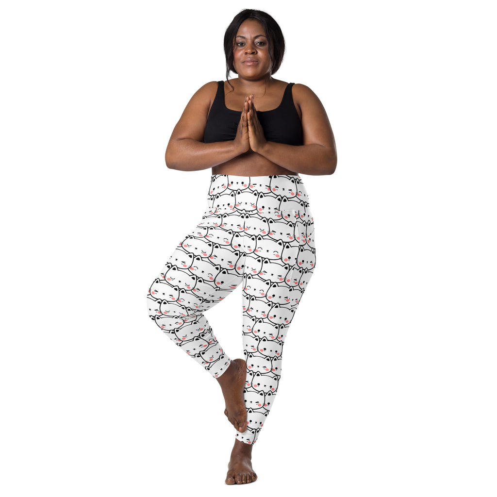 White high waisted yoga leggings with pockets featuring a repeating minimalist kawaii cat face pattern with pink accents