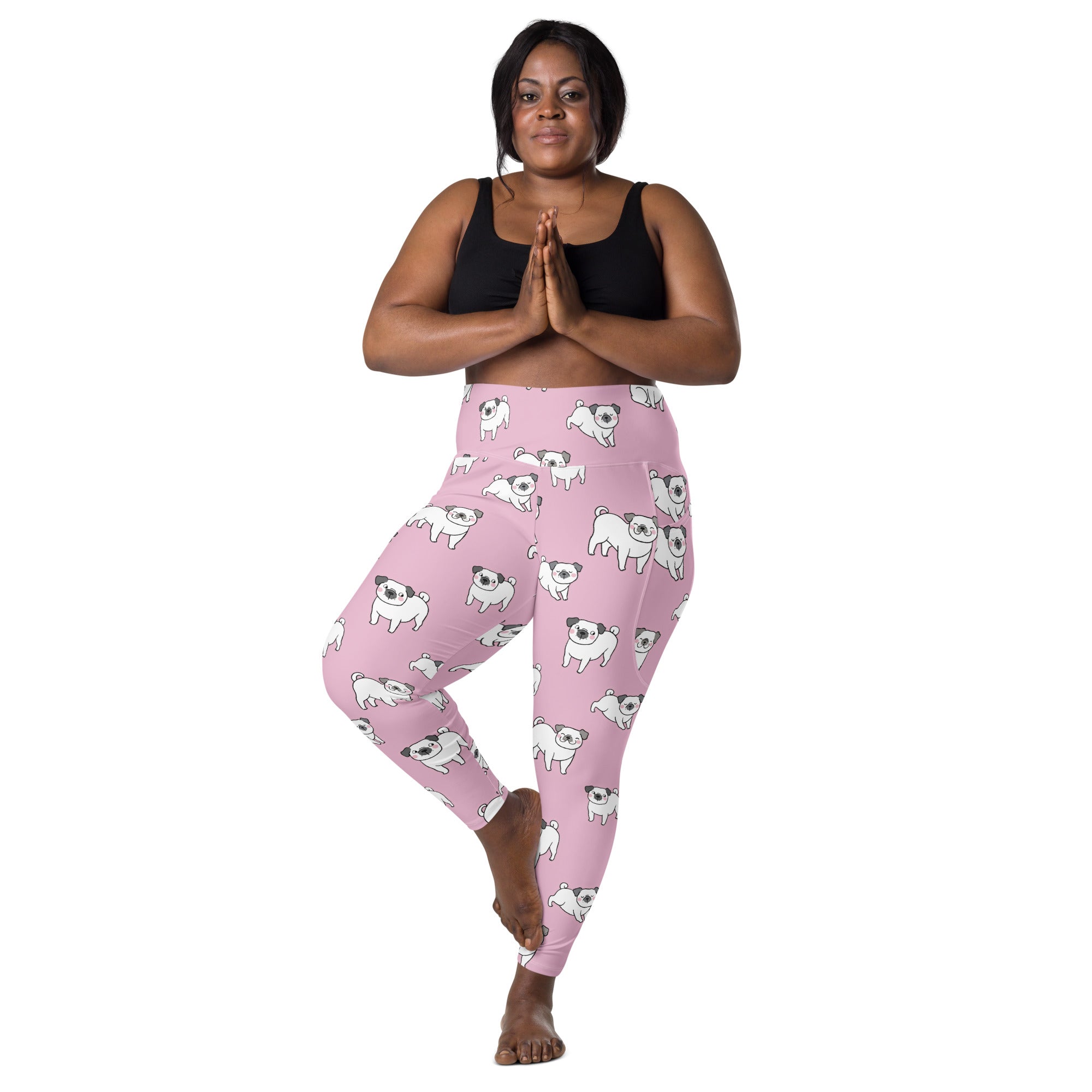 Women’s pink high-waisted yoga leggings with soft compression and white pug pattern featuring pockets