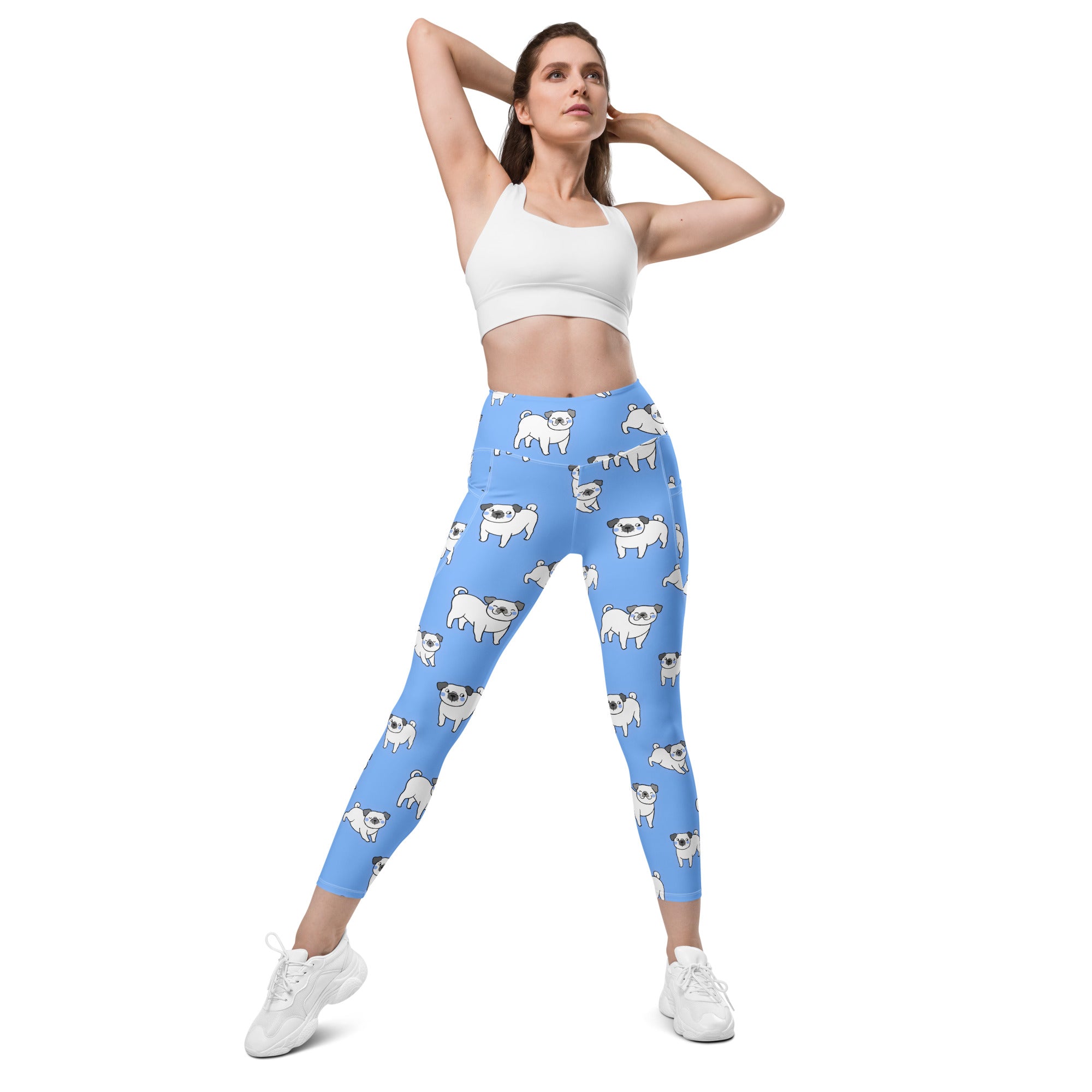 Women’s light blue high-waisted yoga leggings with soft compression and white pug illustrations with pockets