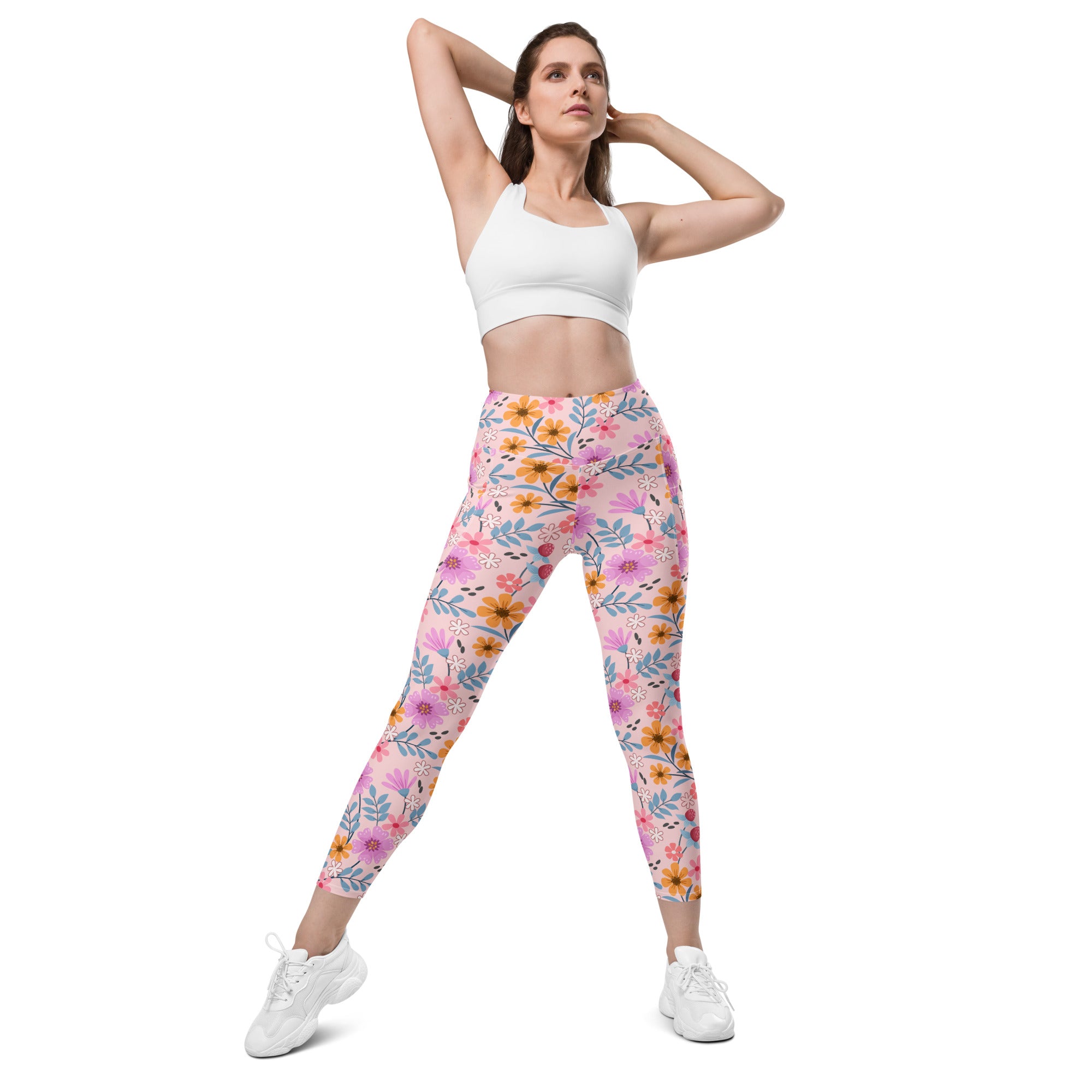 Women’s pink floral yoga leggings with pockets high-waisted soft stretchy fabric and delicate blue and orange accents