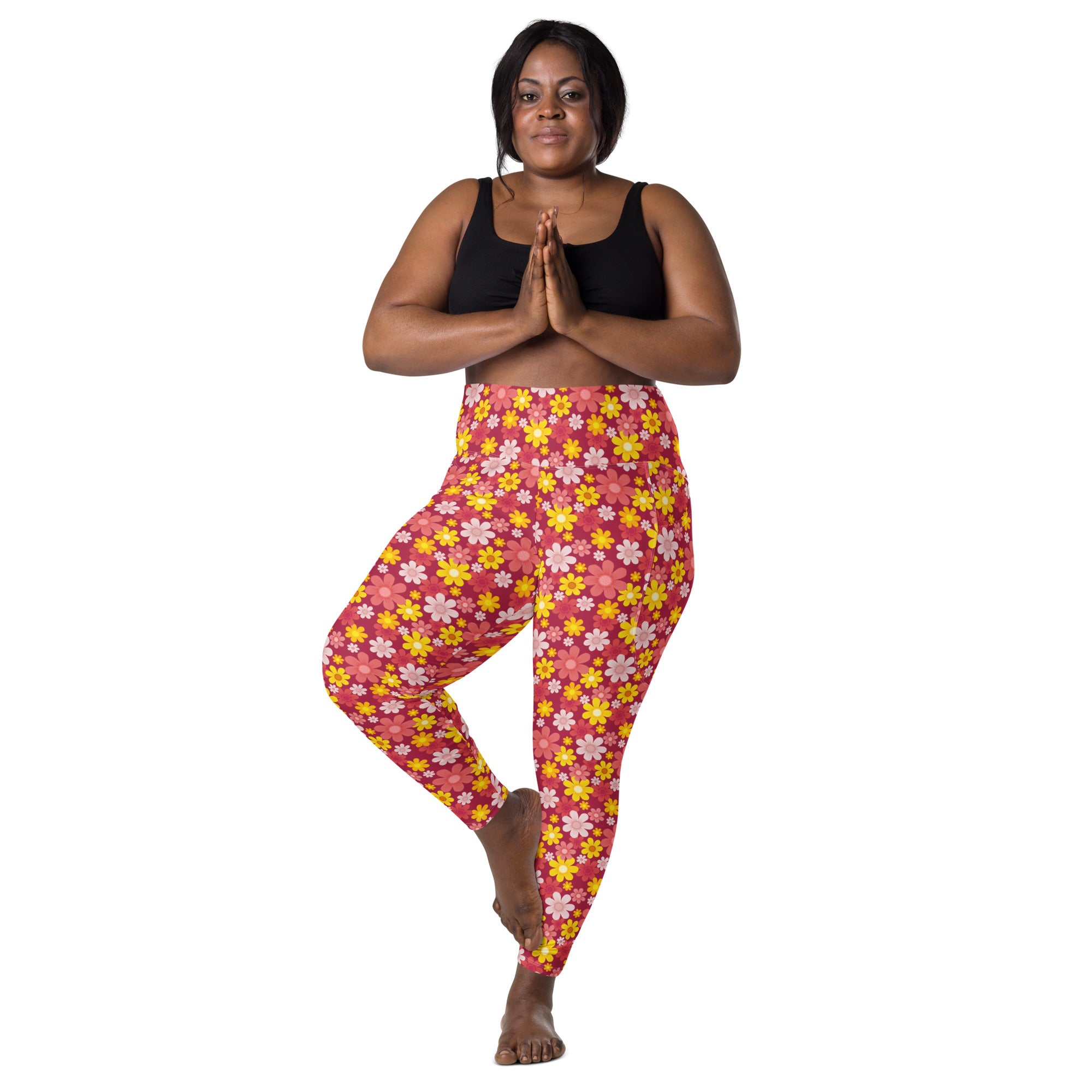 Women’s bright pink high-waisted floral yoga leggings with pockets featuring soft compression and yellow white flowers