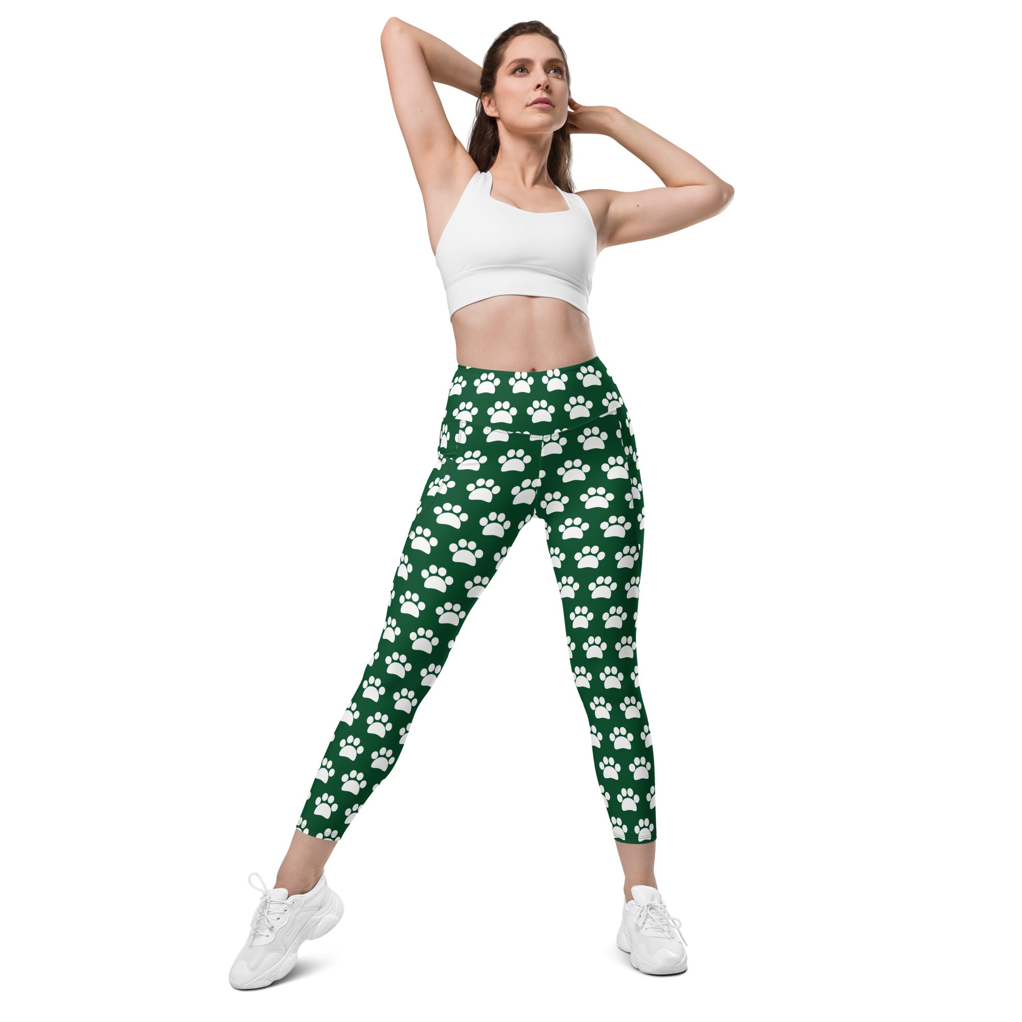 Women’s green paw print high waisted yoga leggings with pockets and soft compression fabric shown from front