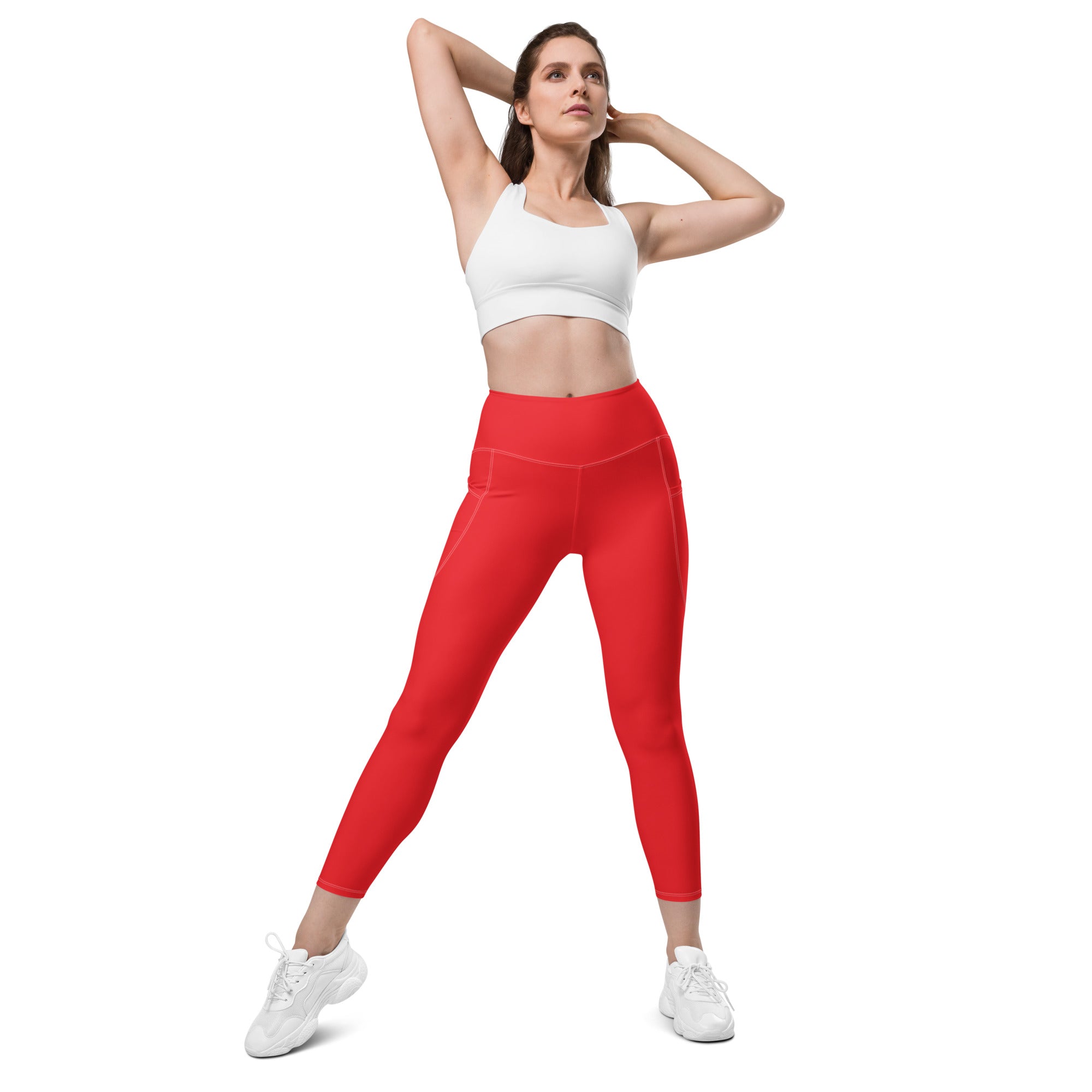 Women’s red high-waisted yoga leggings with side pockets made of smooth stretchy soft compression fabric