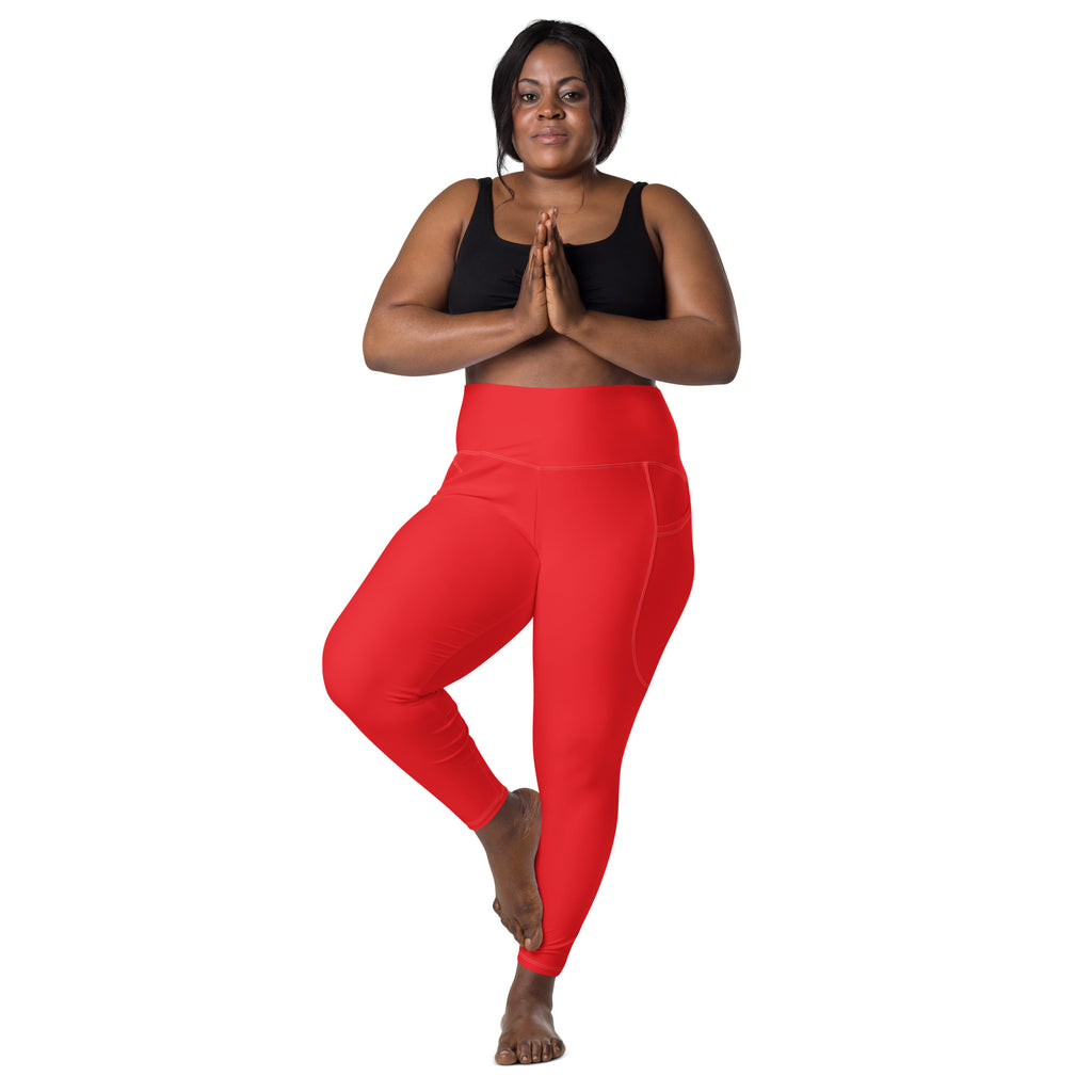 Women’s bright red high-waisted yoga leggings with soft compression fabric and convenient side pockets