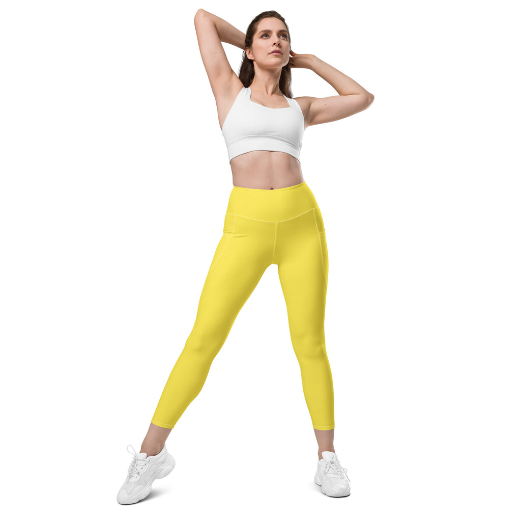 Women’s yellow high-waisted yoga leggings with soft stretchy fabric and side pockets for active wear