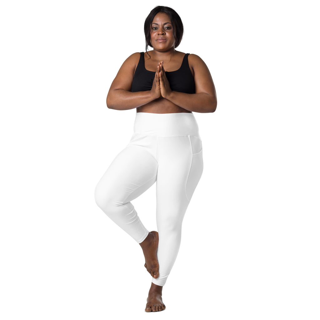 Women’s white high-waisted yoga leggings with soft compression stretch fabric and subtle side pockets