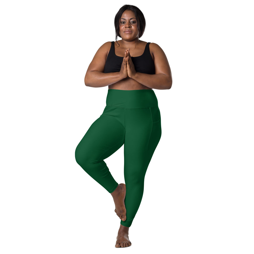 Women’s dark green high-waisted yoga leggings with pockets made of smooth stretchy fabric for soft compression