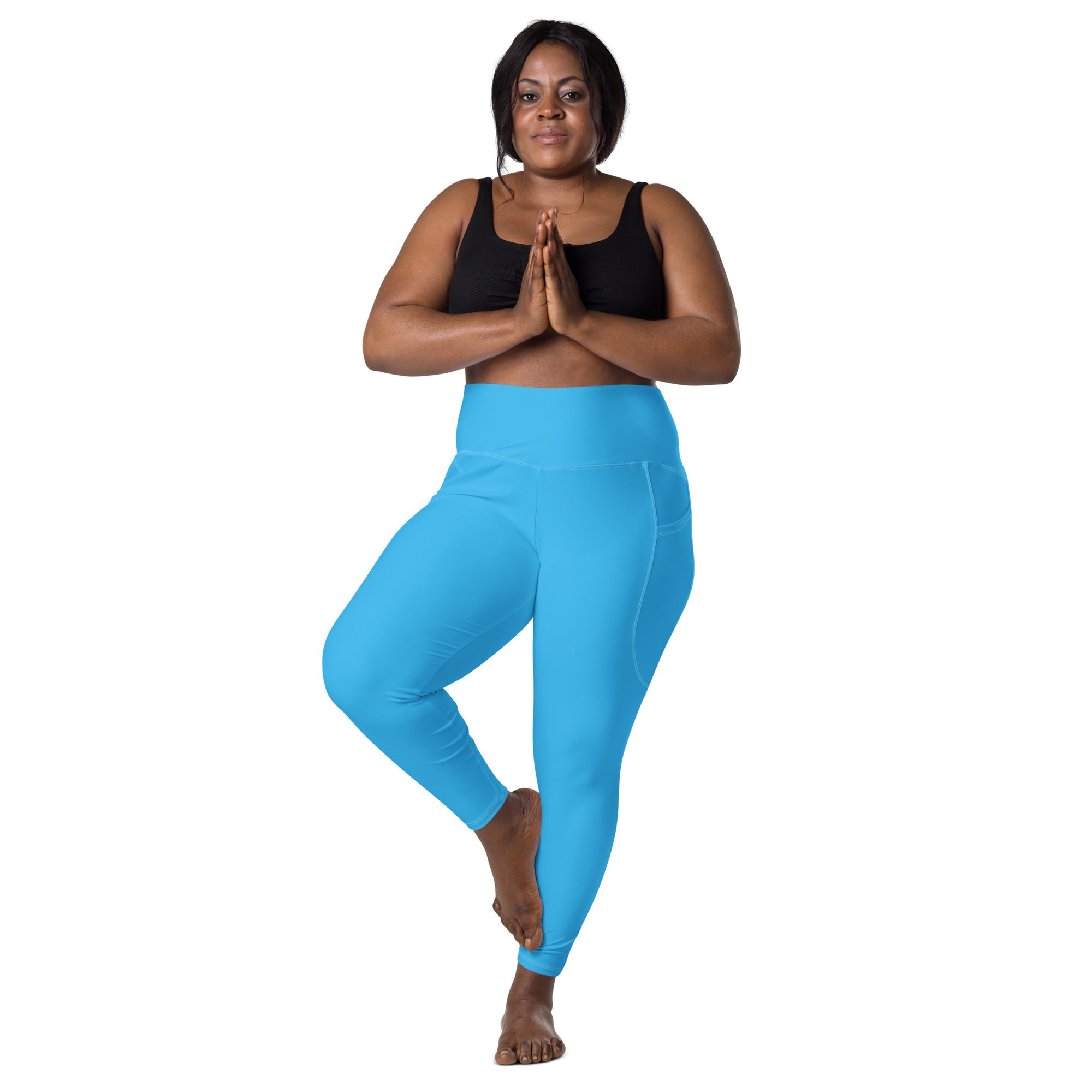Women’s blue high-waisted yoga leggings with soft compression, smooth stretchy fabric, and convenient pockets