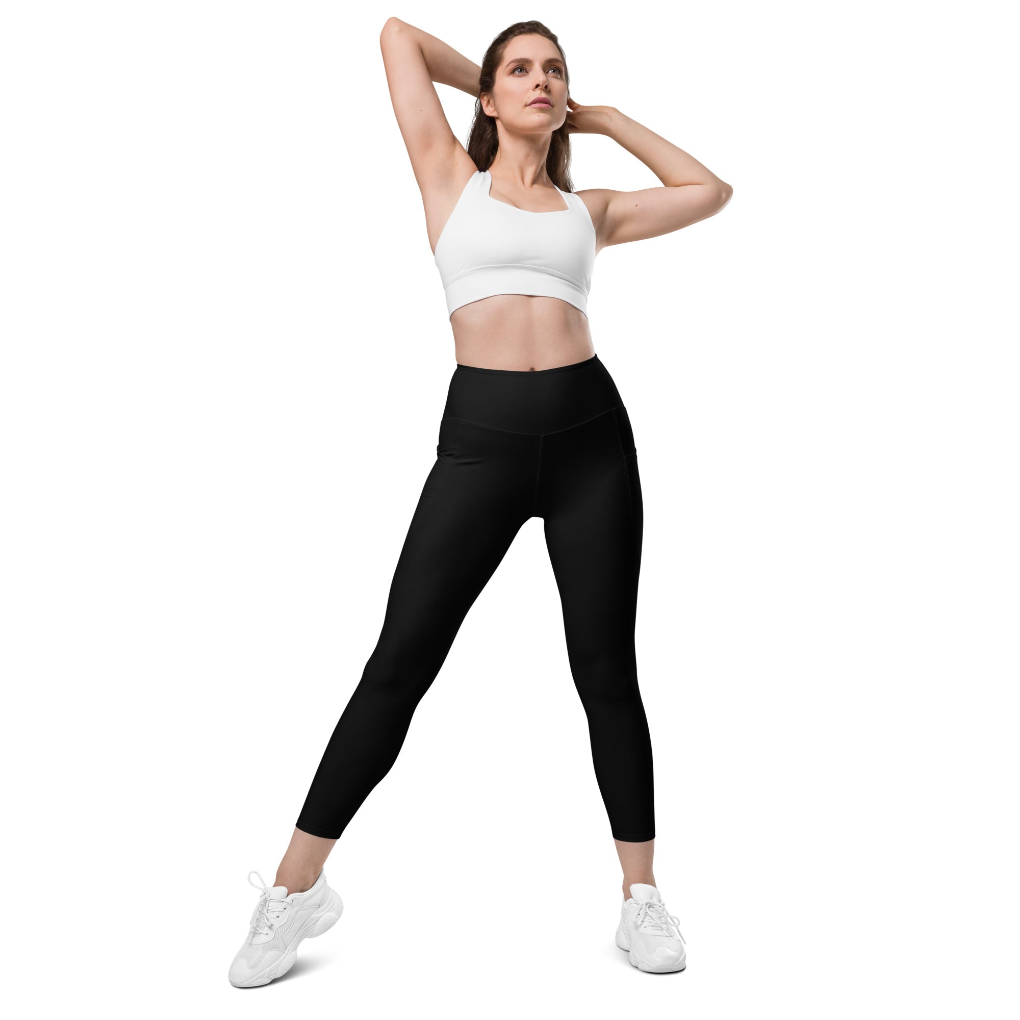 Women’s black high-waisted yoga leggings with pockets featuring smooth seamless soft compression fabric