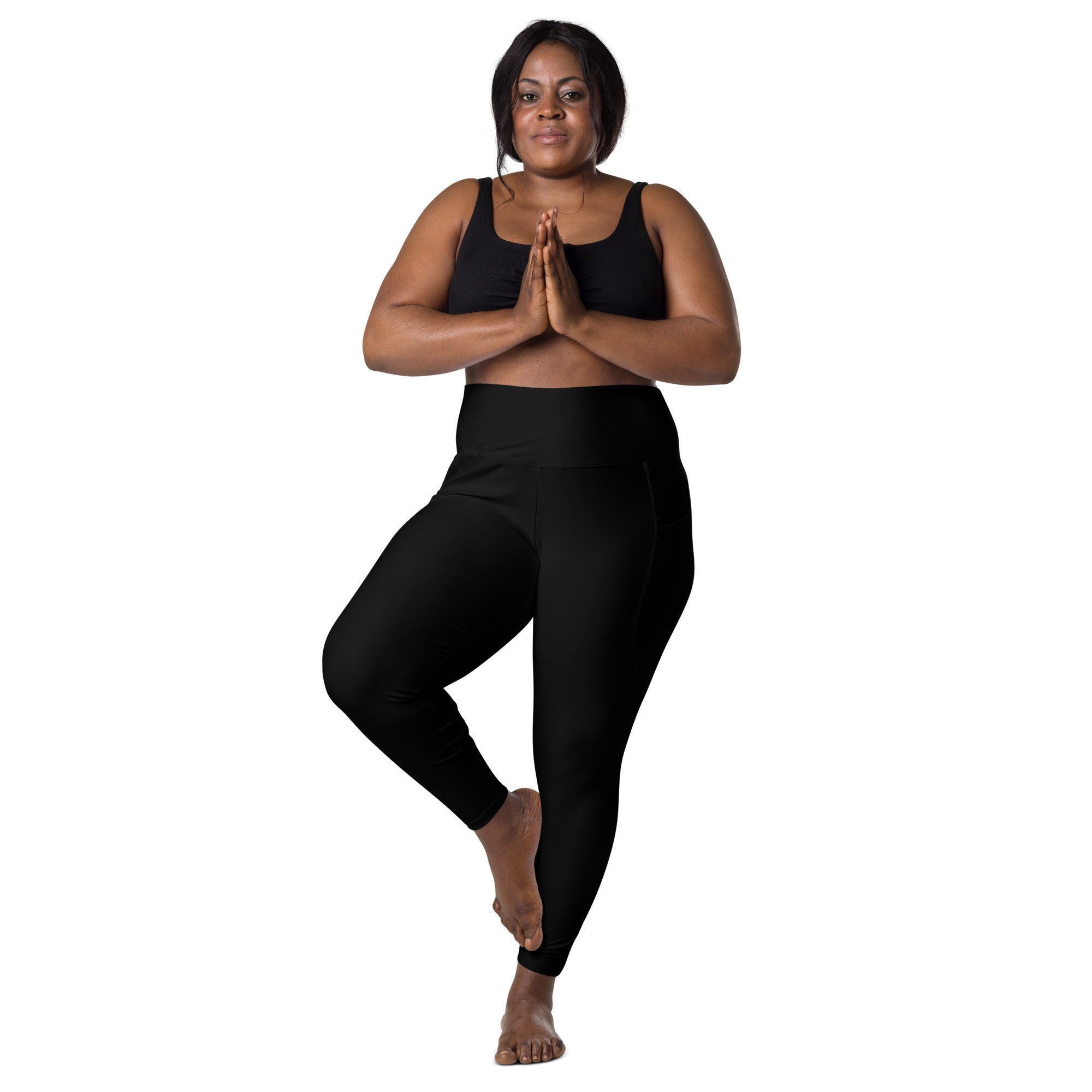 Women’s black high-waisted yoga leggings with pockets featuring smooth stretchy fabric and seamless design