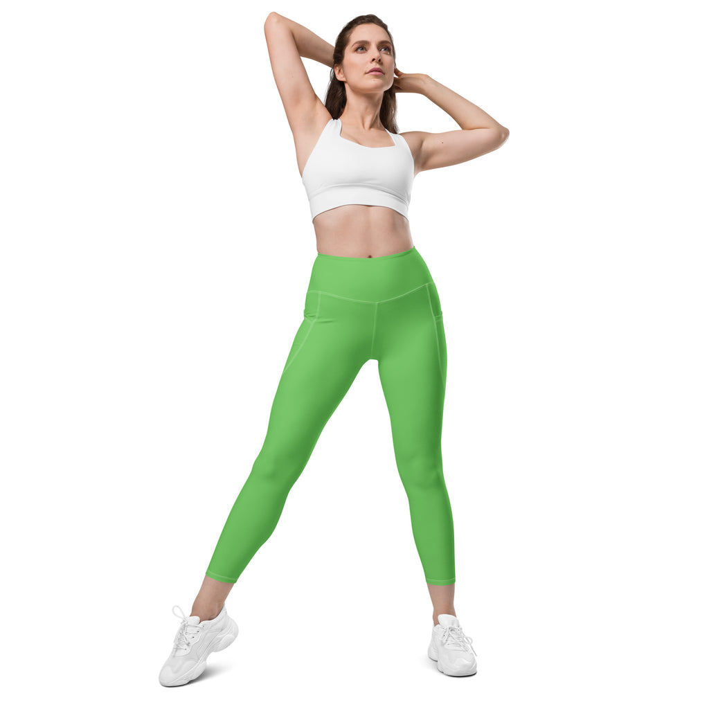 Women’s bright green high-waisted yoga leggings with side pockets and soft compression for active wear