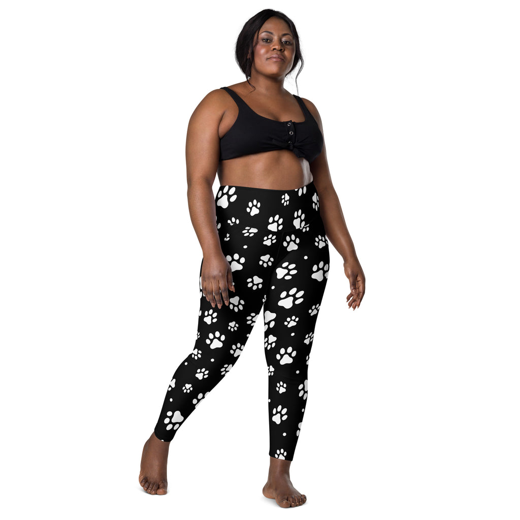 Women’s high-waisted black paw print yoga leggings with pockets made of soft compression fabric for activewear