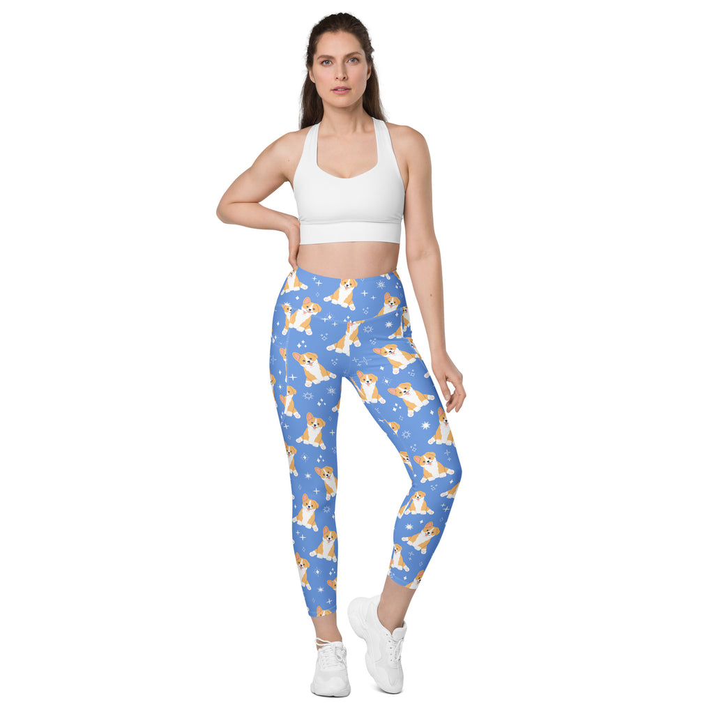 Women’s blue high-waisted corgi dog yoga leggings with pockets featuring tan and white corgi pattern and star accents