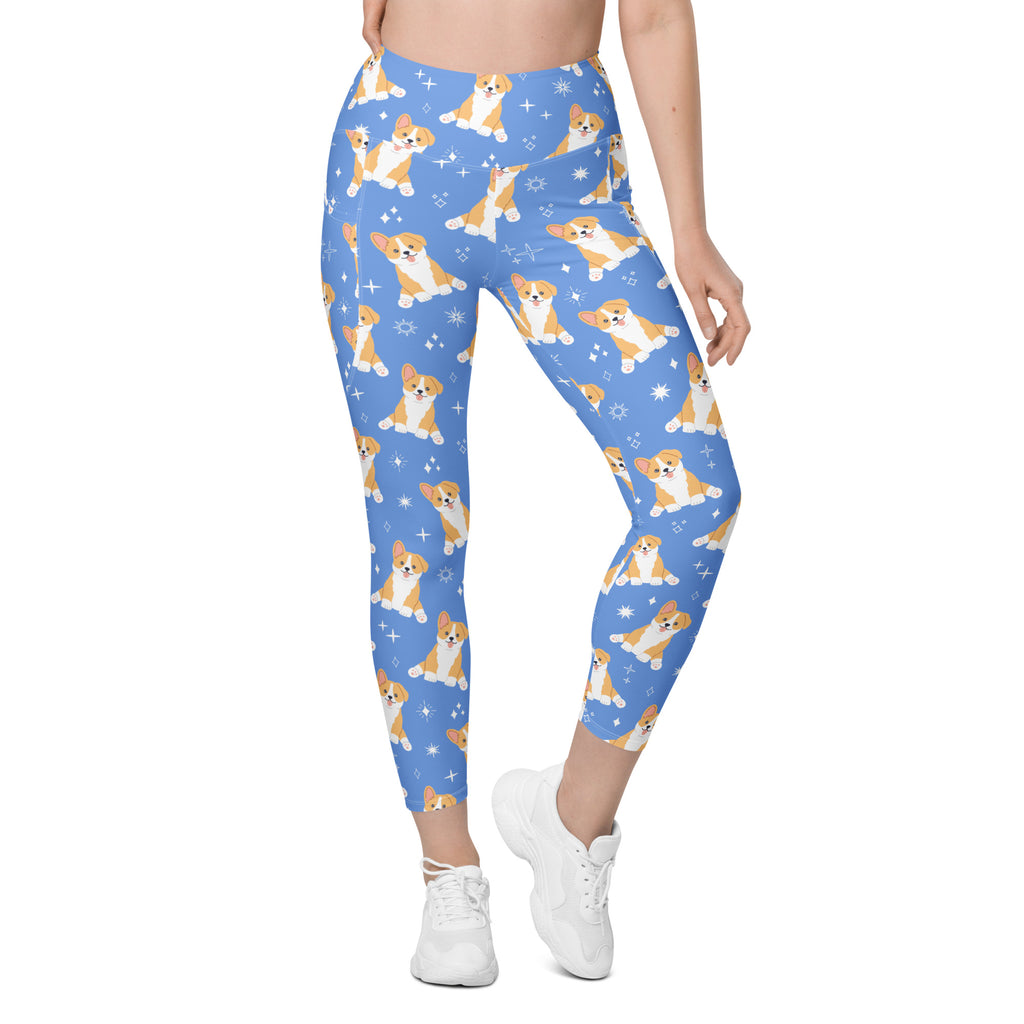 Women’s blue high-waisted yoga leggings with pockets featuring a soft compression fabric and corgi dog snowflake pattern