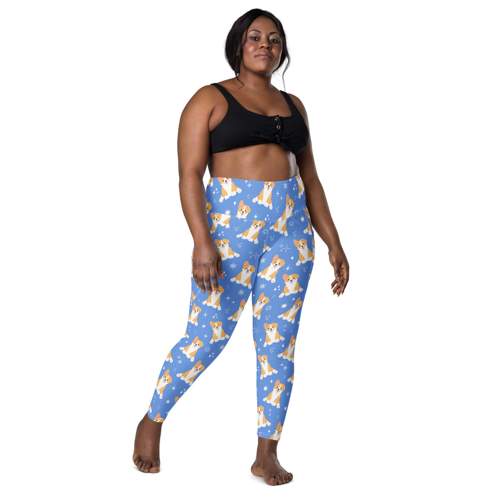 Women’s blue high-waisted corgi dog yoga leggings with pockets featuring tan and white corgi pattern and star accents