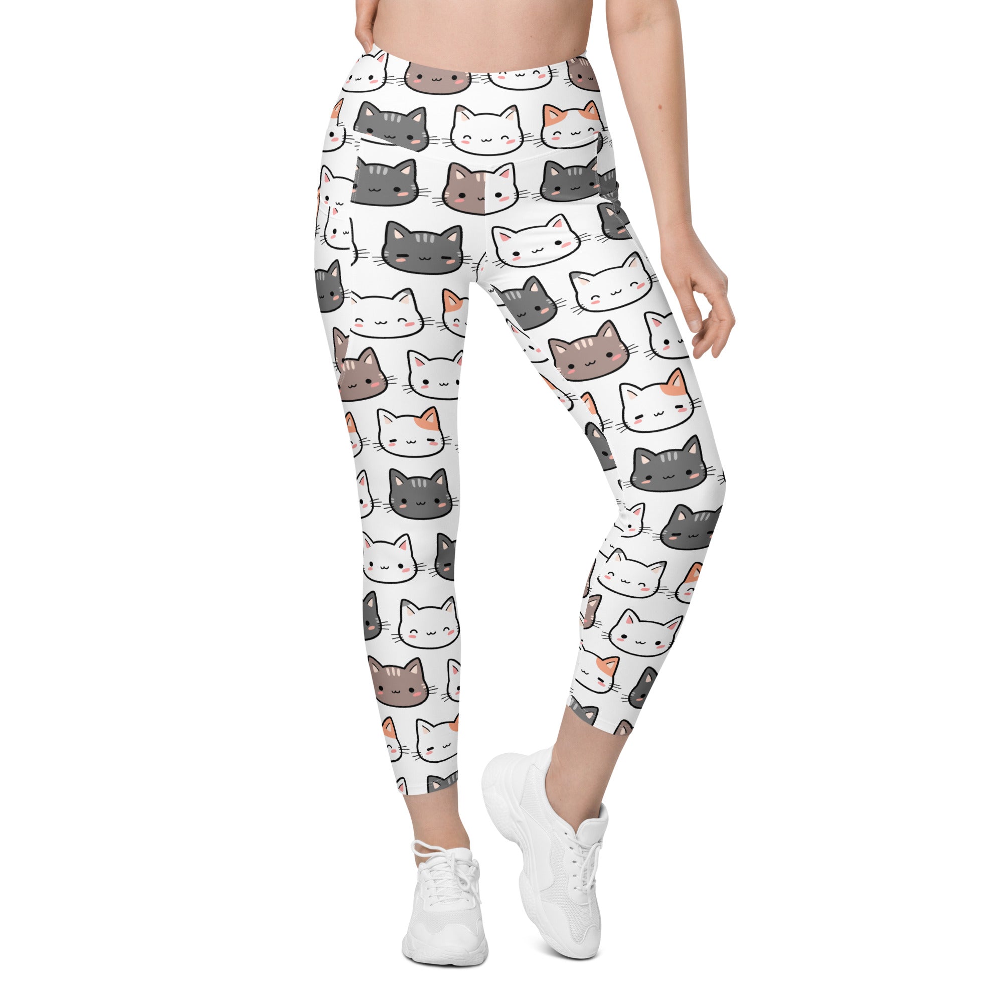 White women’s high-waisted yoga leggings with soft compression and colorful cartoon cat face pattern and pockets