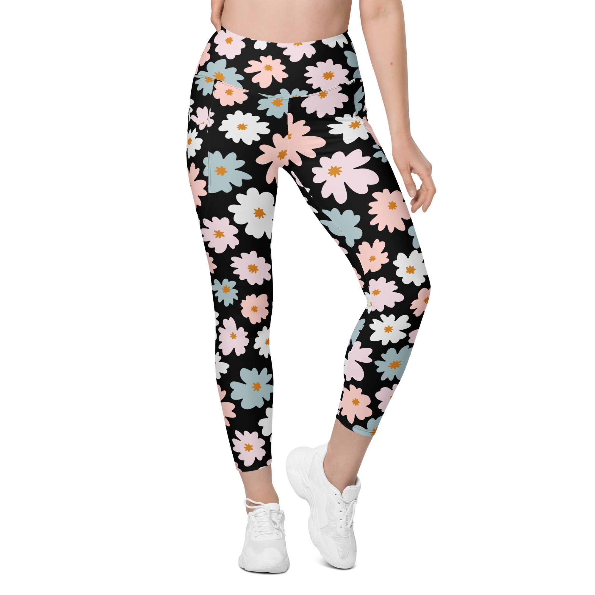 Women’s retro floral yoga leggings with pockets in black featuring pink white and light blue daisies with yellow centers