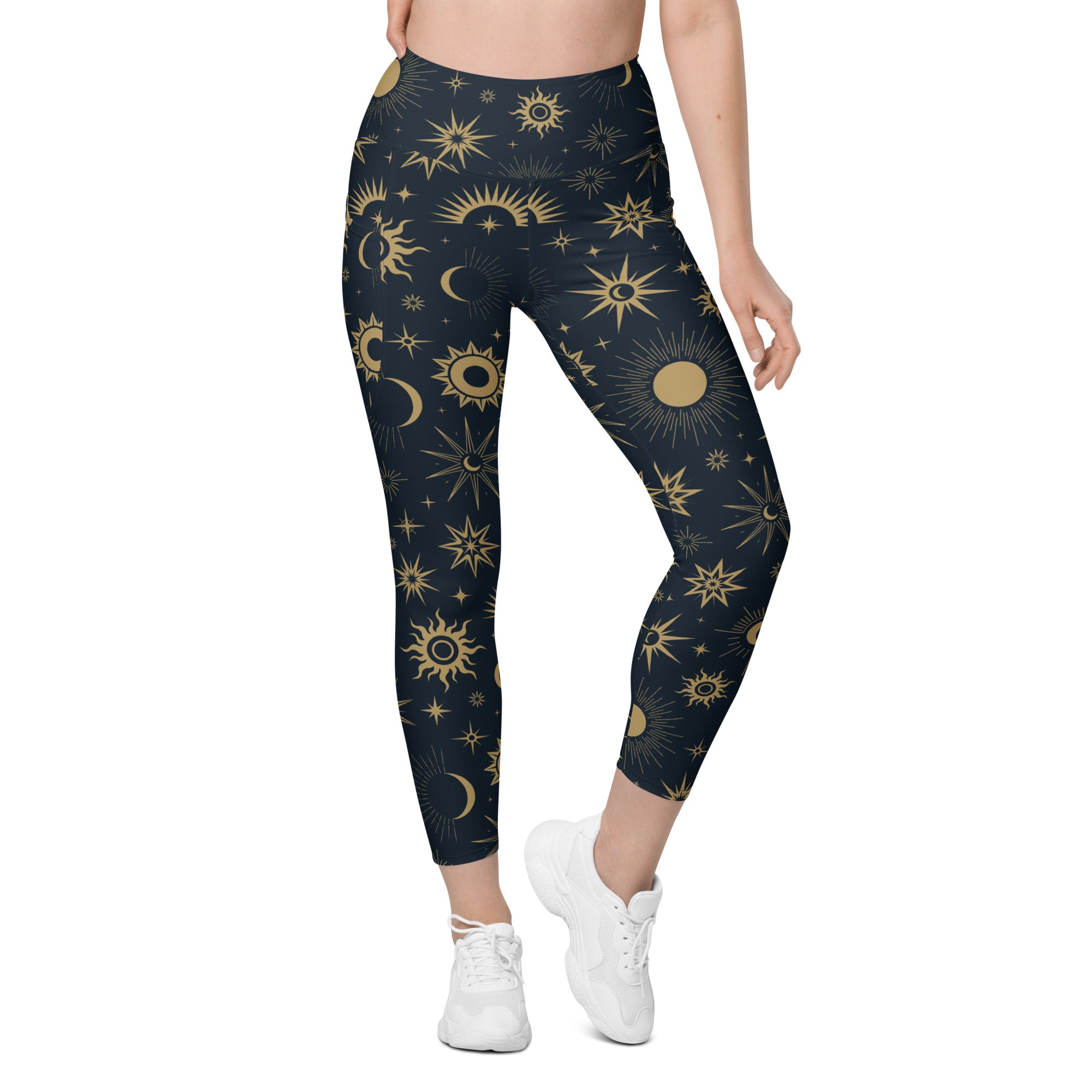 Dark blue high-waisted women’s yoga leggings with soft compression and vibrant gold celestial sun moon and stars pattern