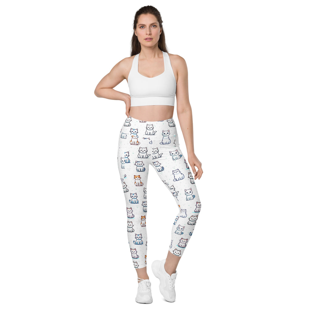 White high-waisted women’s yoga leggings with soft compression and playful multicolor cartoon cat pattern with pockets