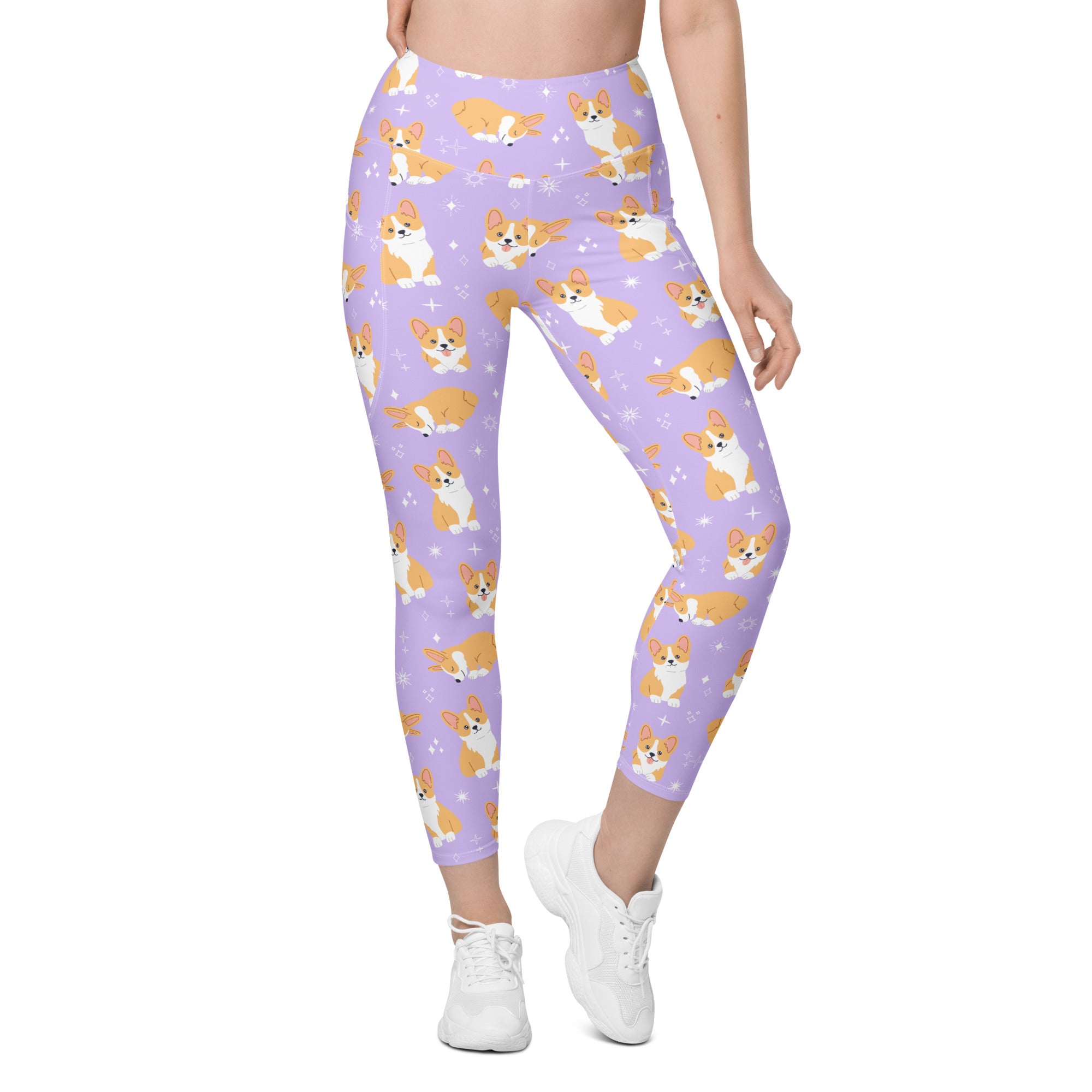 Women’s purple high-waisted yoga leggings with pockets feature soft compression and orange and white cartoon corgi pattern