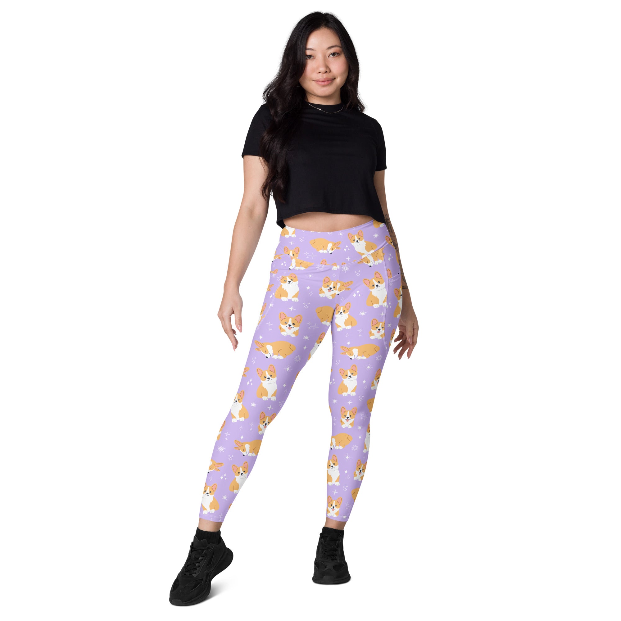 Women’s purple high-waisted corgi dog yoga leggings with pockets featuring a soft compression fabric and orange white corgis pattern