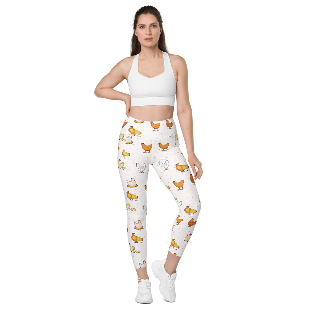 White women’s chicken yoga leggings with pockets featuring colorful cartoon chickens and soft compression fabric