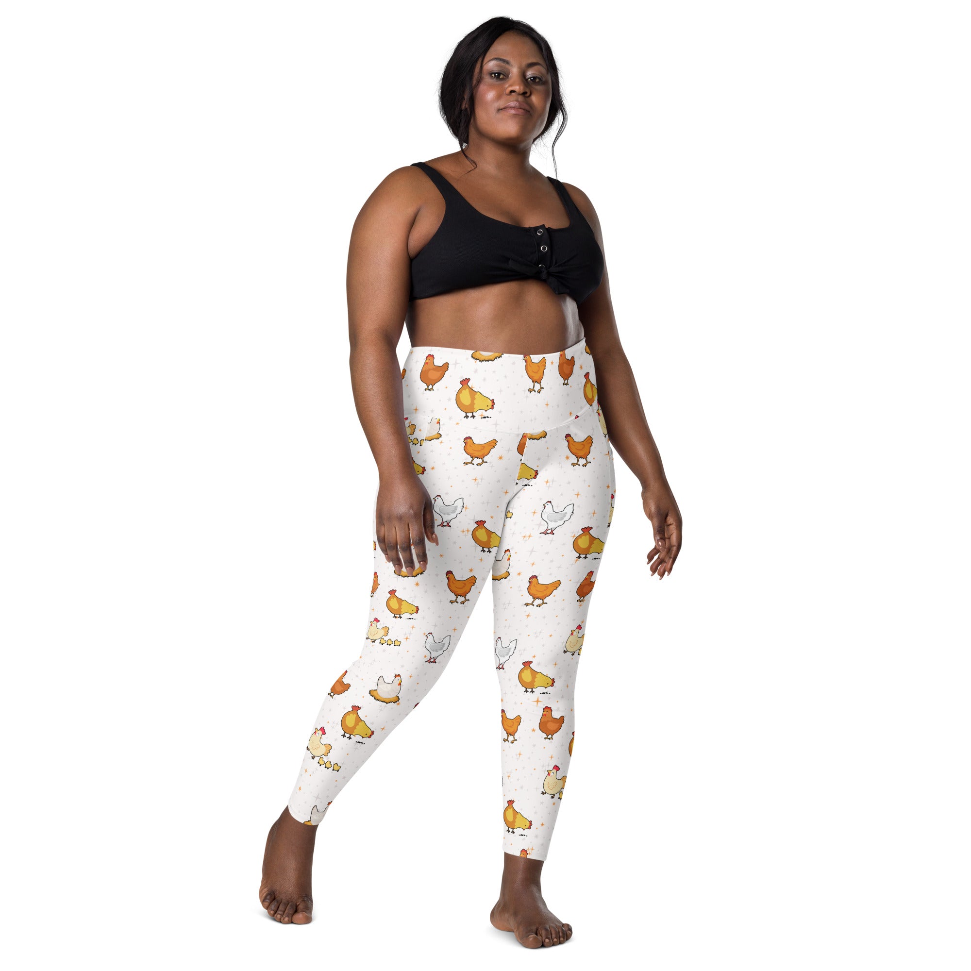Women’s white high-waisted chicken yoga leggings with pockets featuring colorful cartoon chicken pattern