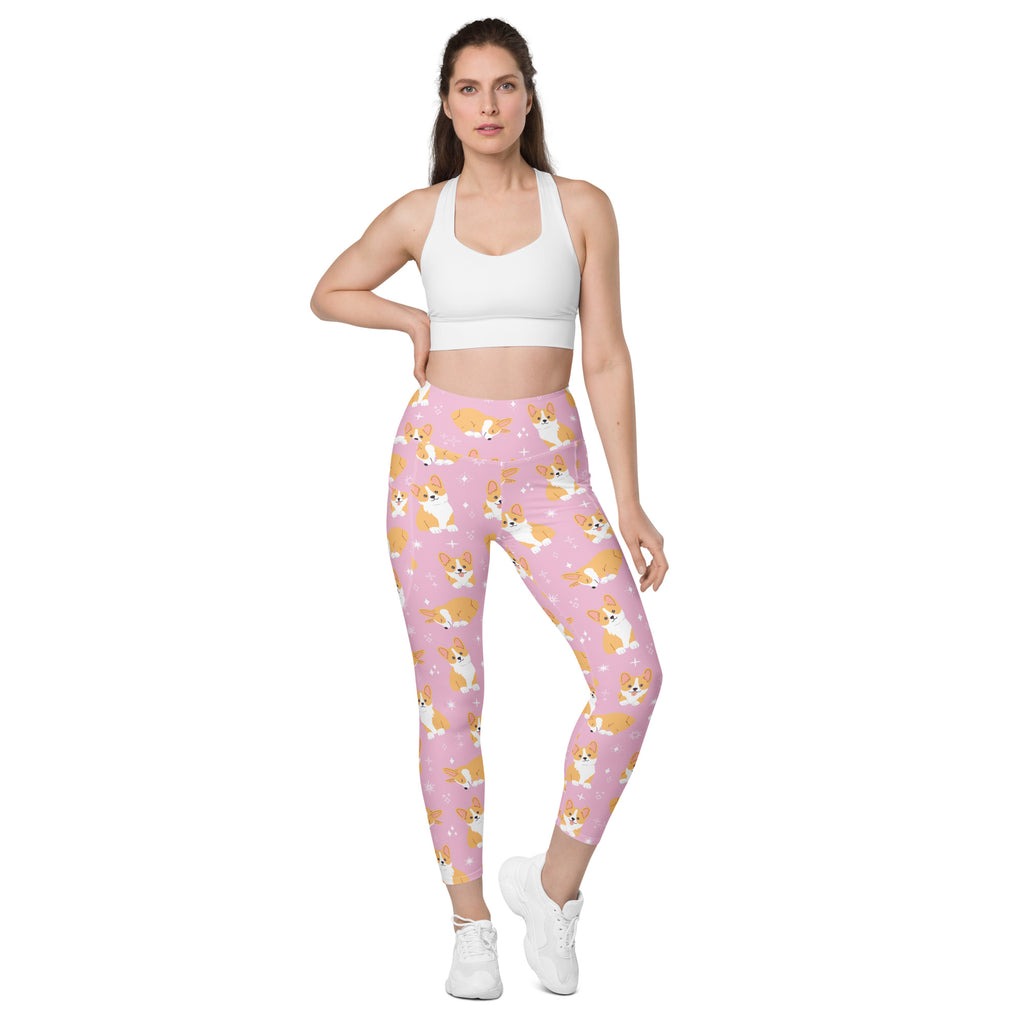 Women’s pink high-waisted corgi dog yoga leggings with pockets featuring soft compression fabric and tan and white corgi pattern