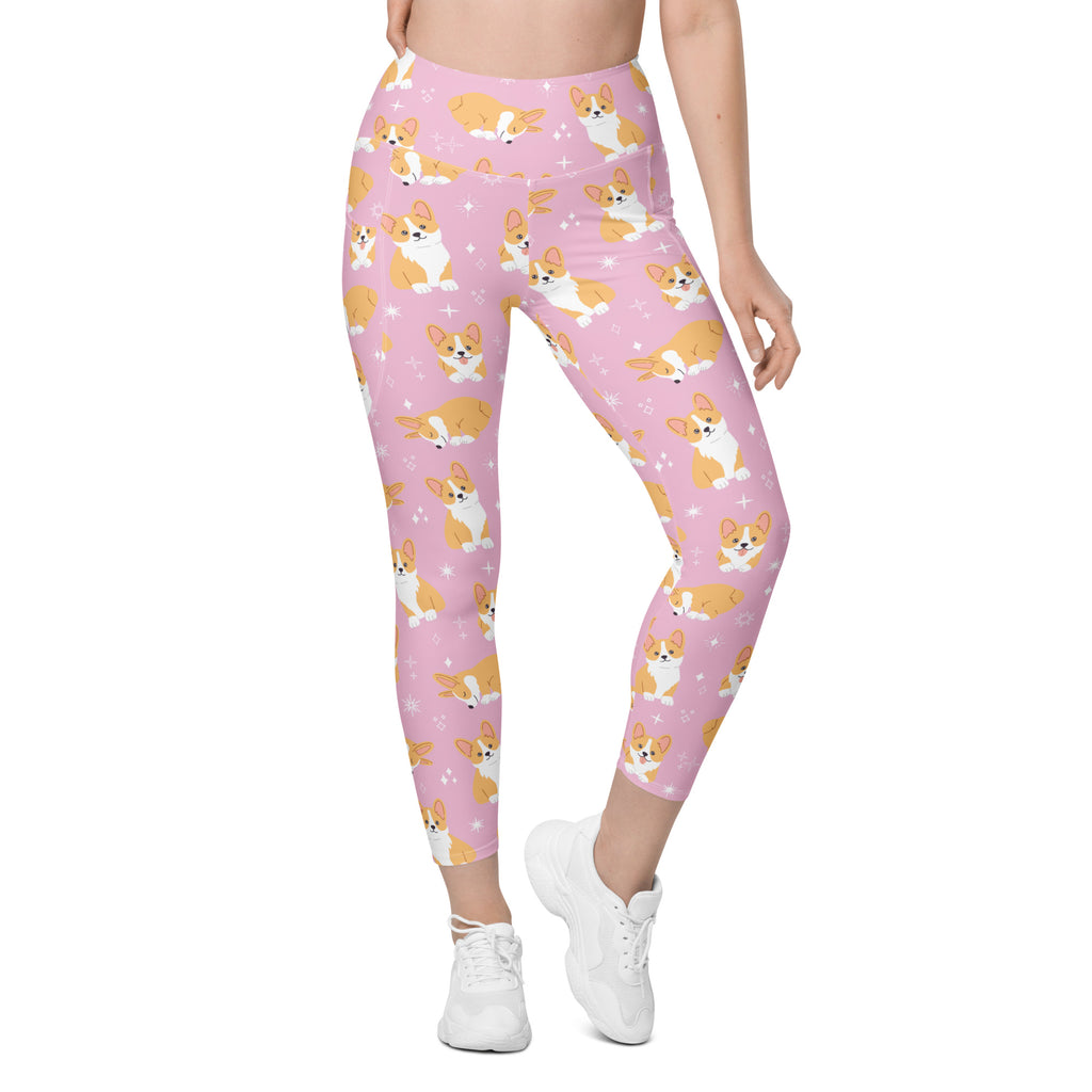 Women’s pink high waisted corgi dog yoga leggings with soft compression and pockets featuring cartoon orange and white corgis