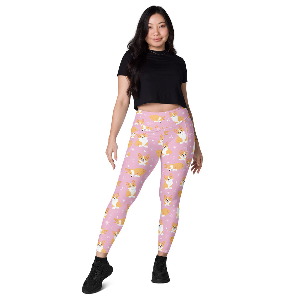 Women’s pink high-waisted corgi dog yoga leggings with pockets featuring tan and white cartoon corgi pattern