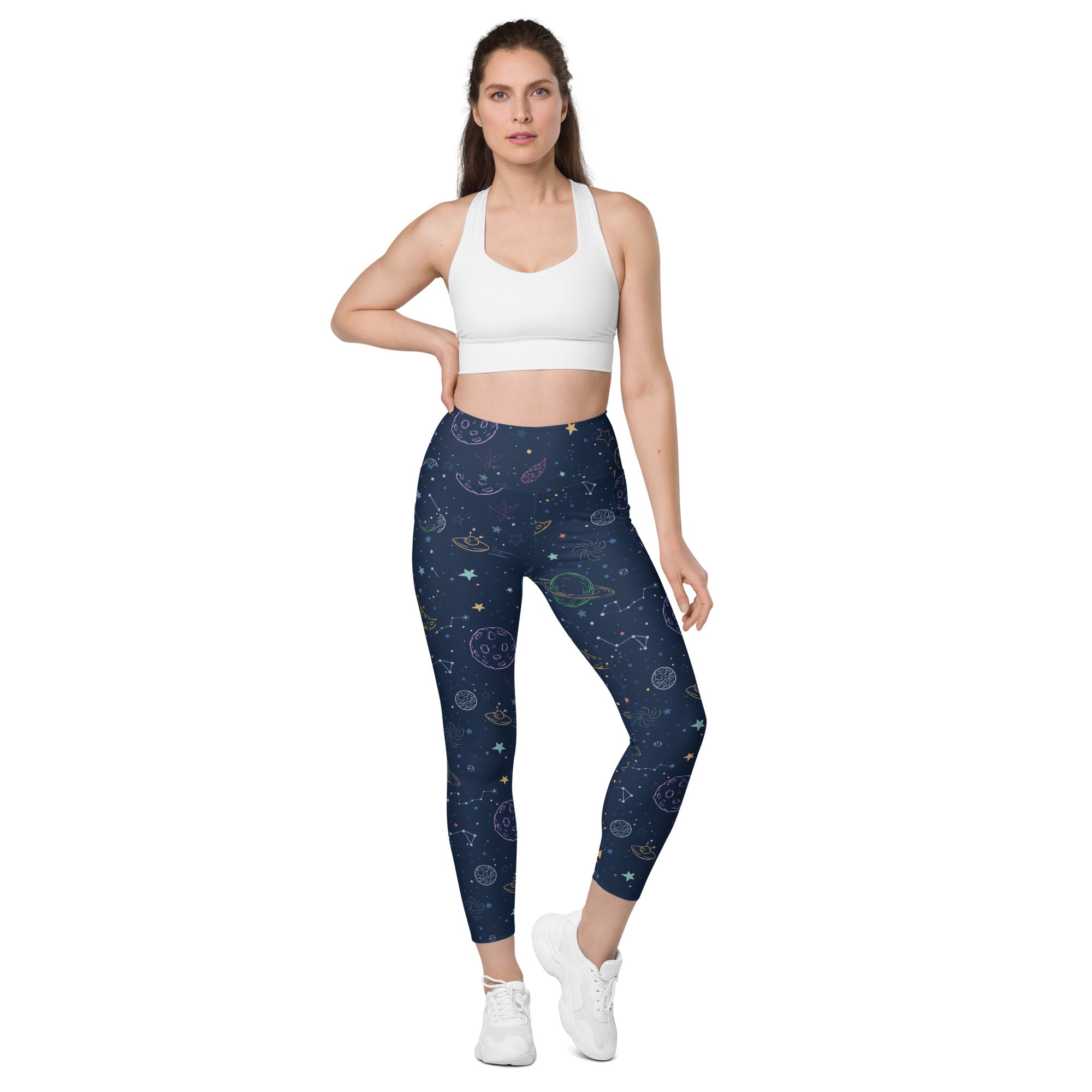 Navy blue women’s high-waisted yoga leggings with soft compression and colorful cosmic planets stars design with pockets