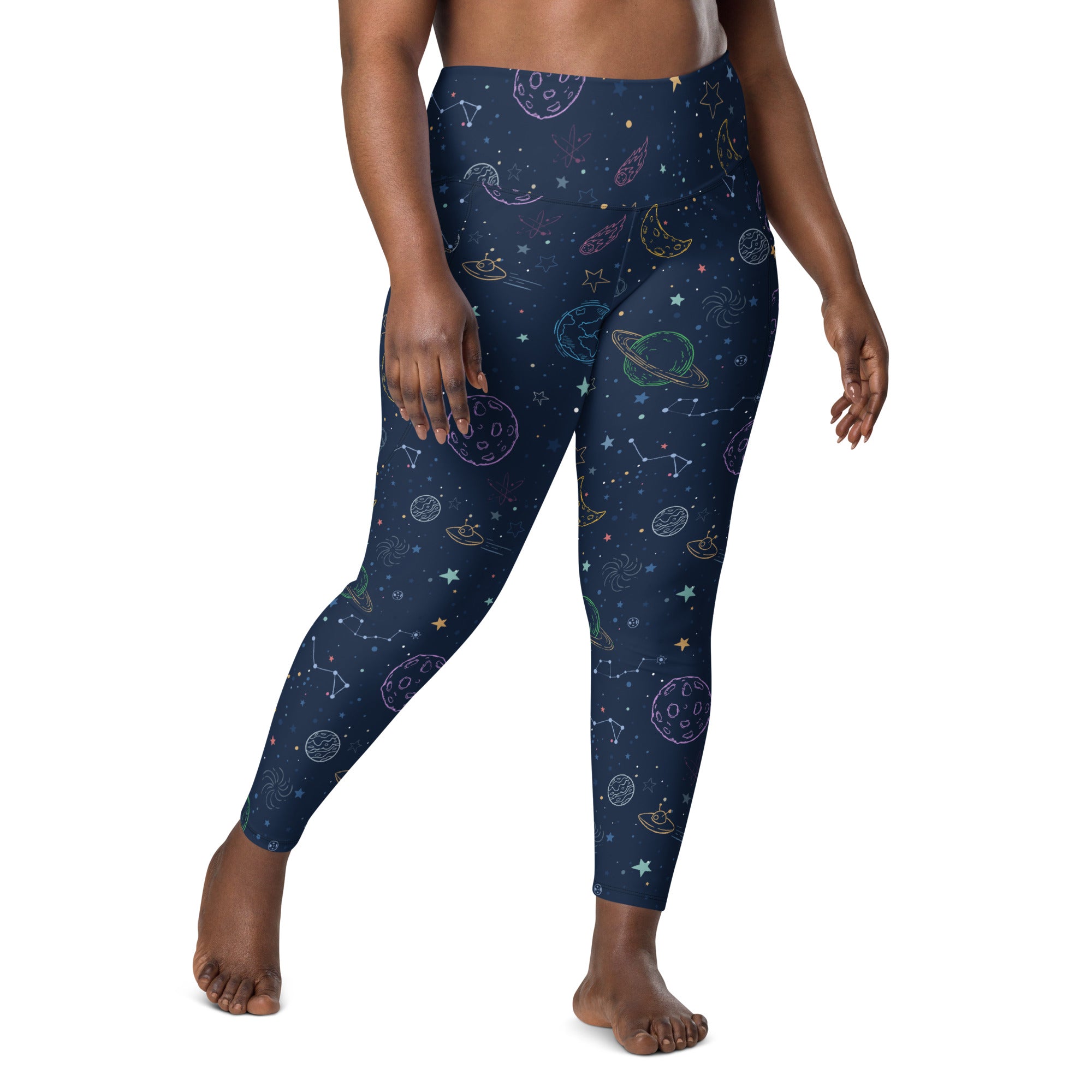 Dark blue plus-size high-waisted yoga leggings with soft compression and pastel space-themed planets stars constellations and ufos