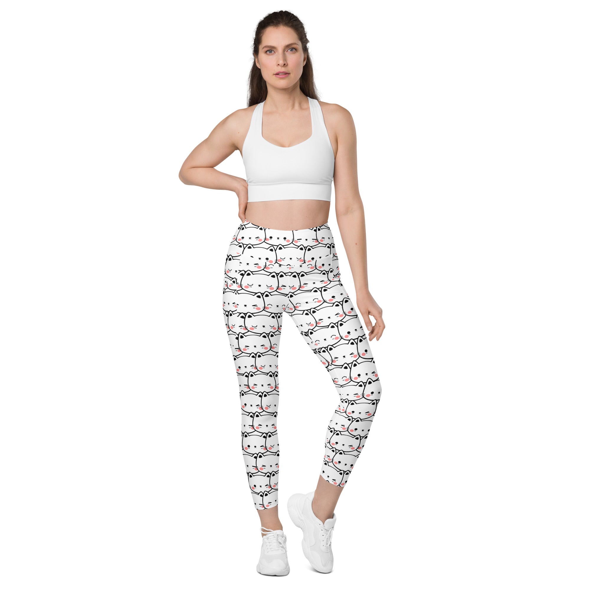 White women’s kawaii cat face yoga leggings with pockets featuring a black and pink cartoon cat pattern