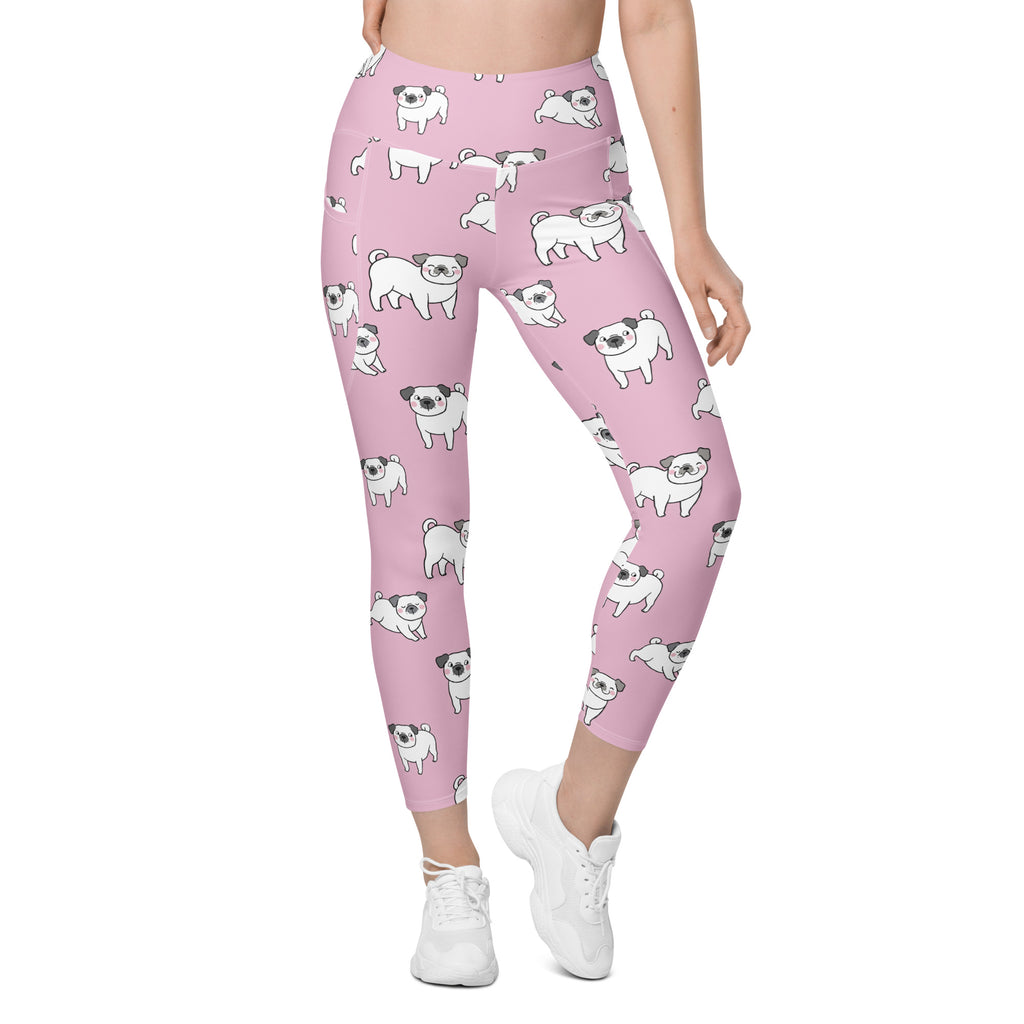 Women’s pink high-waisted soft compression yoga leggings with pockets featuring a white cartoon pug pattern