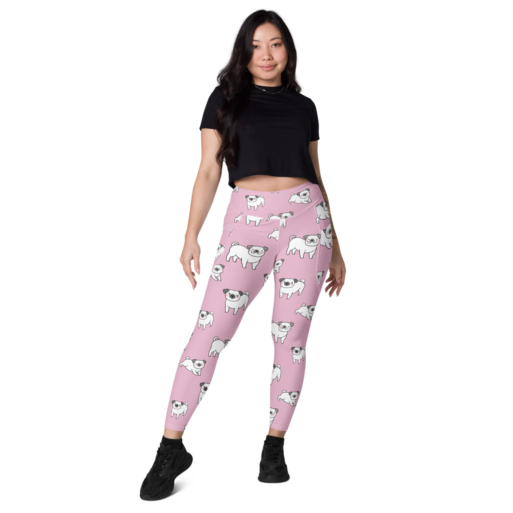 Women’s pink high-waisted yoga leggings with pockets featuring soft compression and white cartoon pug pattern
