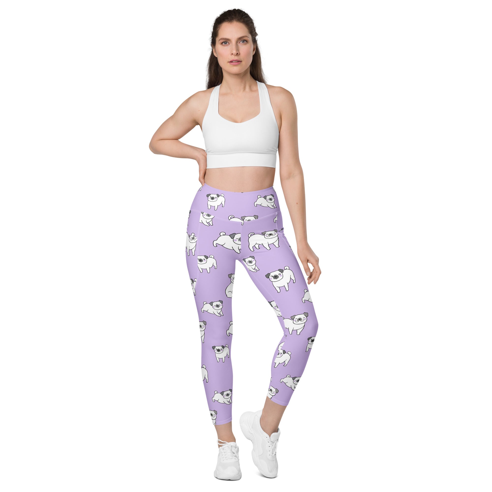 Women’s purple high-waisted yoga leggings with pockets featuring soft compression and a playful white pug pattern