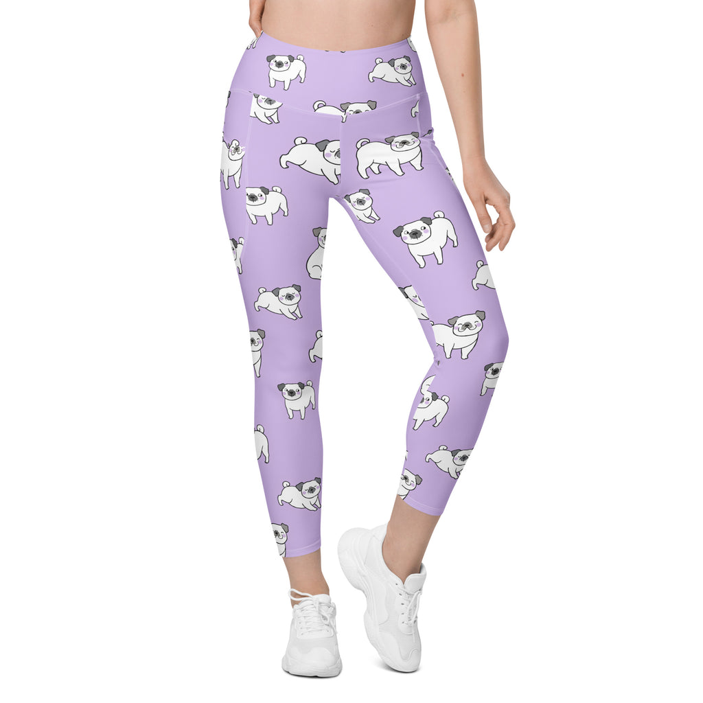 Women’s lilac high-waisted yoga leggings with pockets featuring white cartoon pugs and soft compression fabric