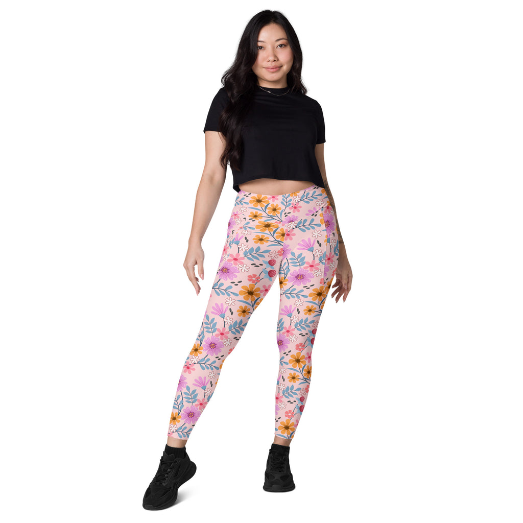Women’s pink floral yoga leggings with pockets high-waisted soft compression fabric and vibrant flower pattern