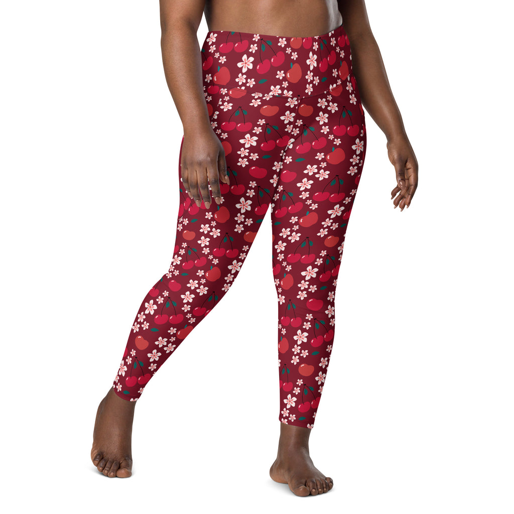 Women’s high-waisted plus-size yoga leggings with red cherry and white flower pattern and soft compression fabric