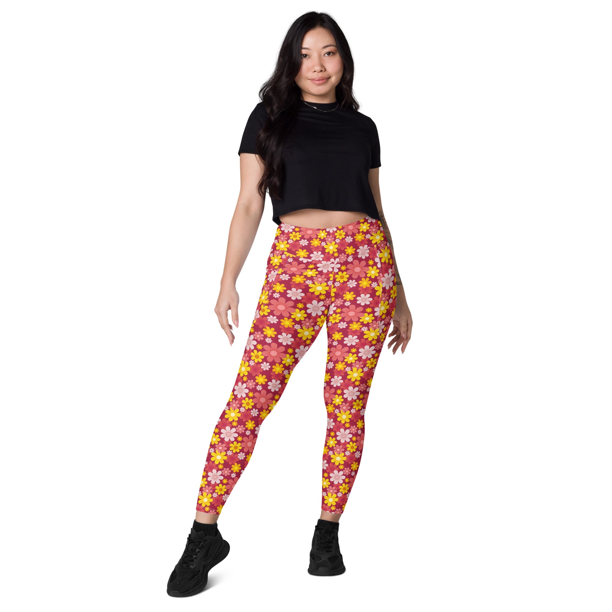 Women’s high-waisted pink and yellow floral yoga leggings with pockets and soft compression for active wear