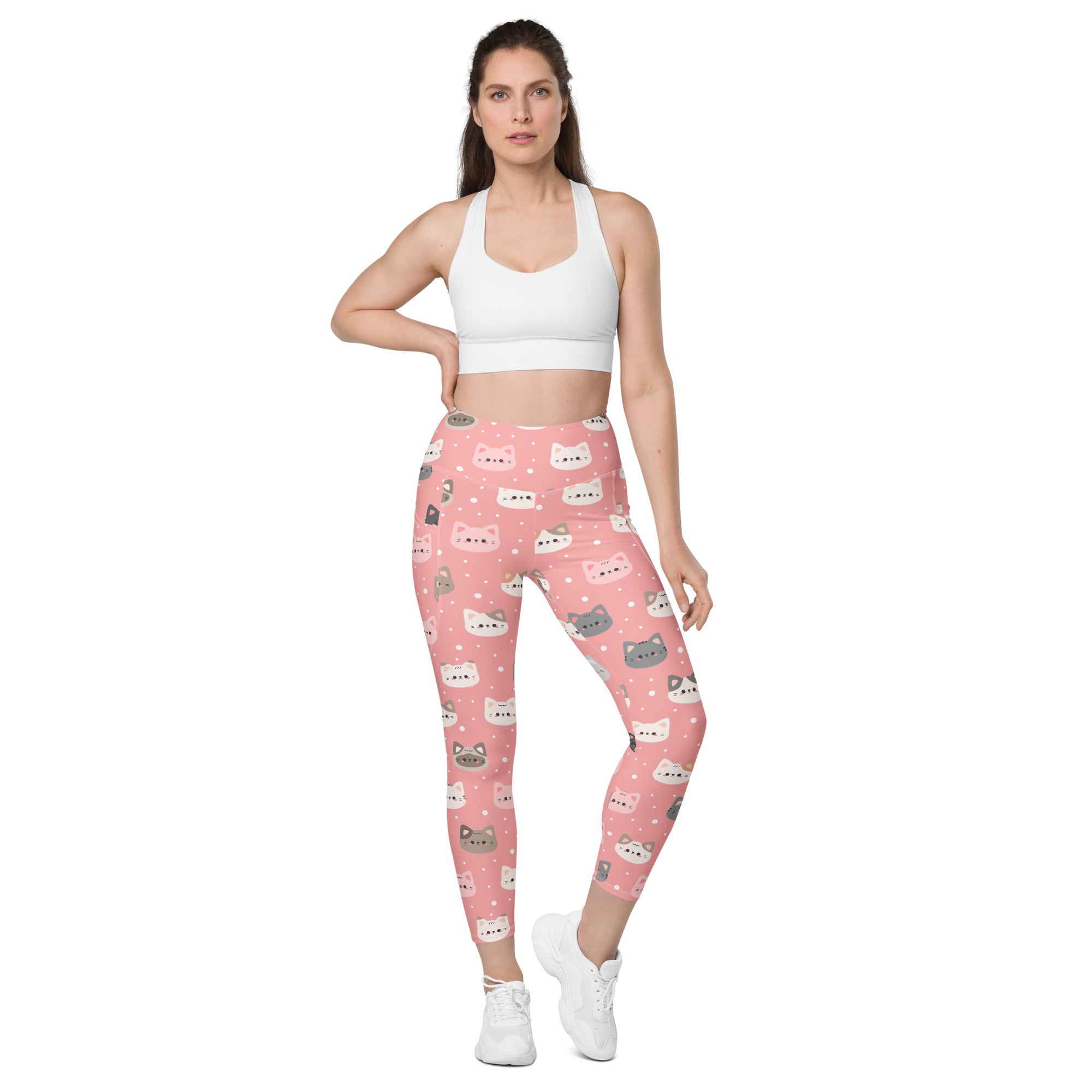 Women’s high-waisted pink cat faces yoga leggings with pockets soft compression fabric and playful cartoon cats pattern