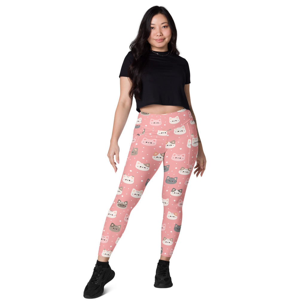 Women’s high-waisted pink yoga leggings with playful white and gray cat faces soft compression and pockets