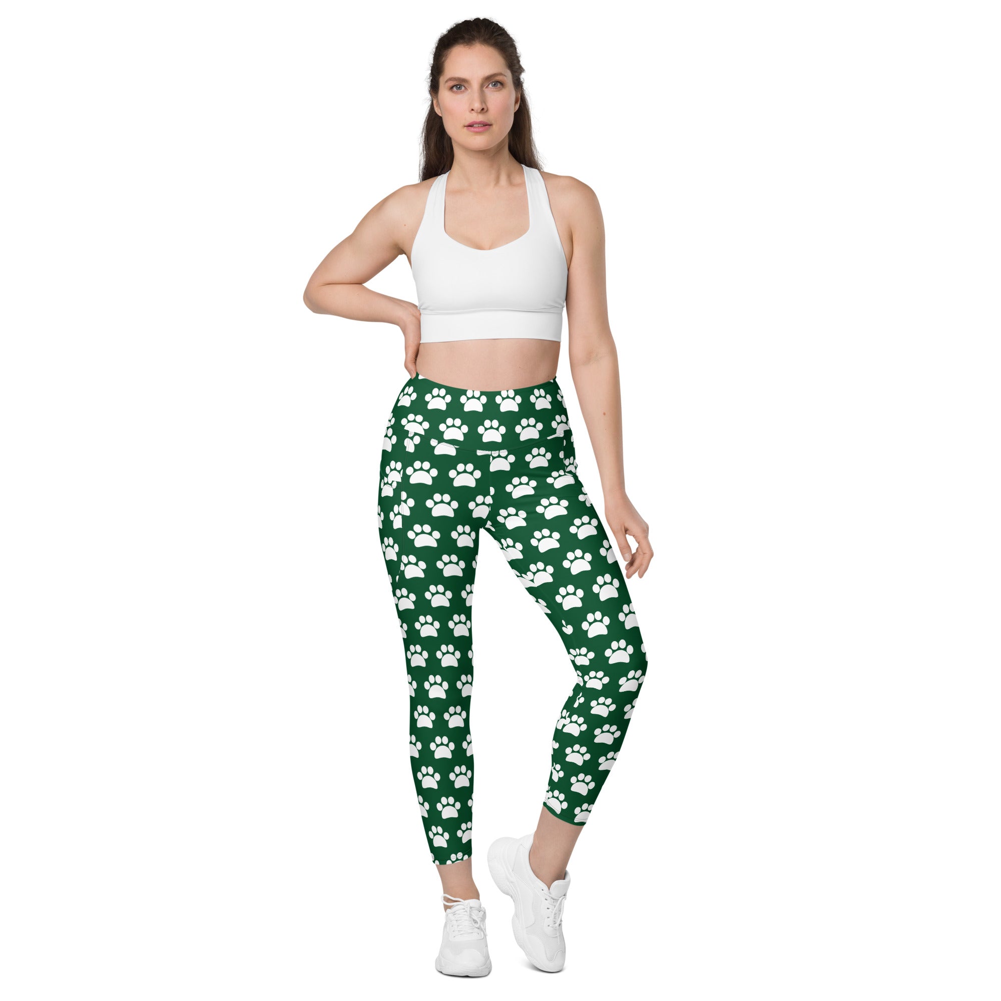 Women’s green high-waisted yoga leggings with white paw print pattern soft compression and pockets