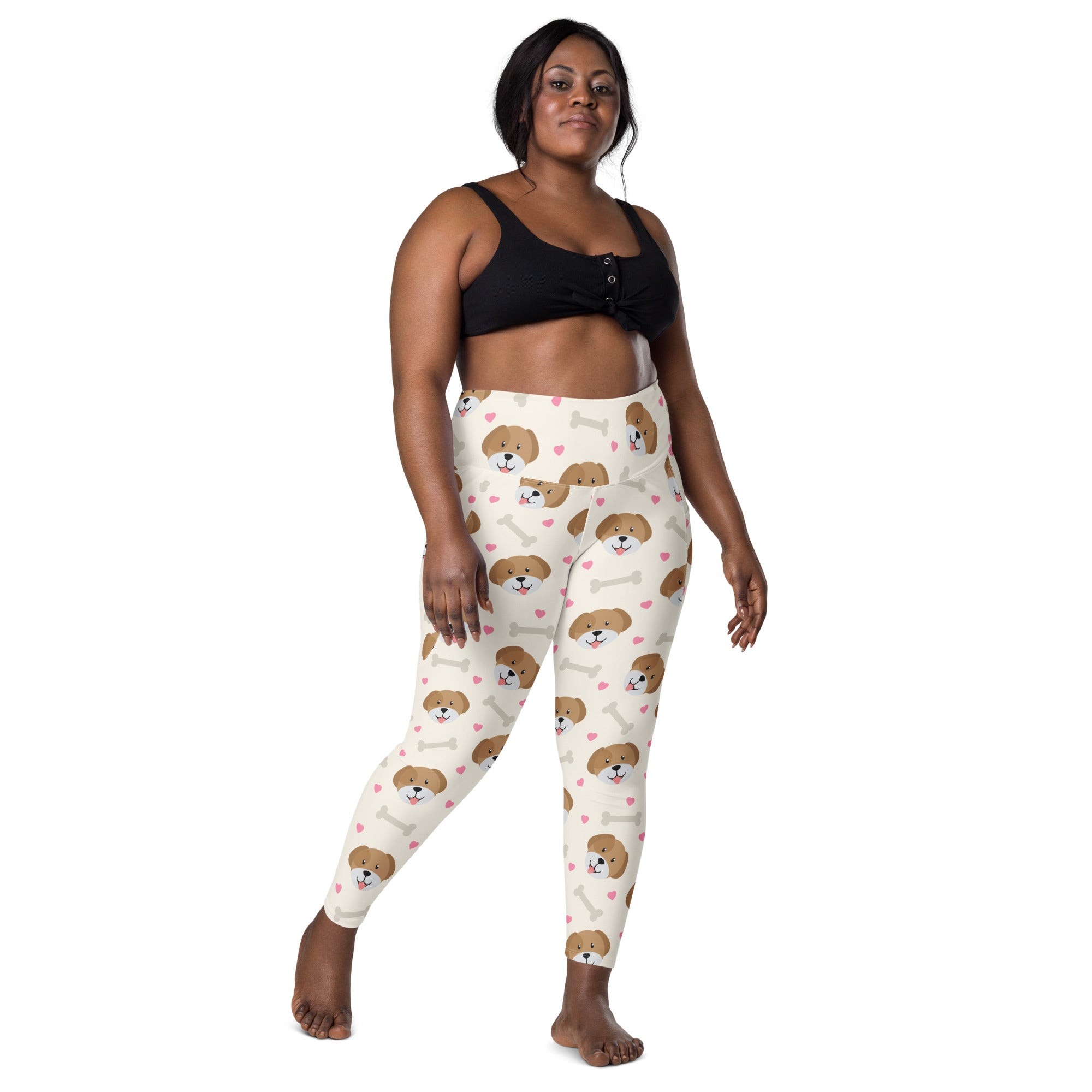 Cream-colored women’s cute dog yoga leggings with pockets featuring brown puppy faces white bones and pink hearts pattern