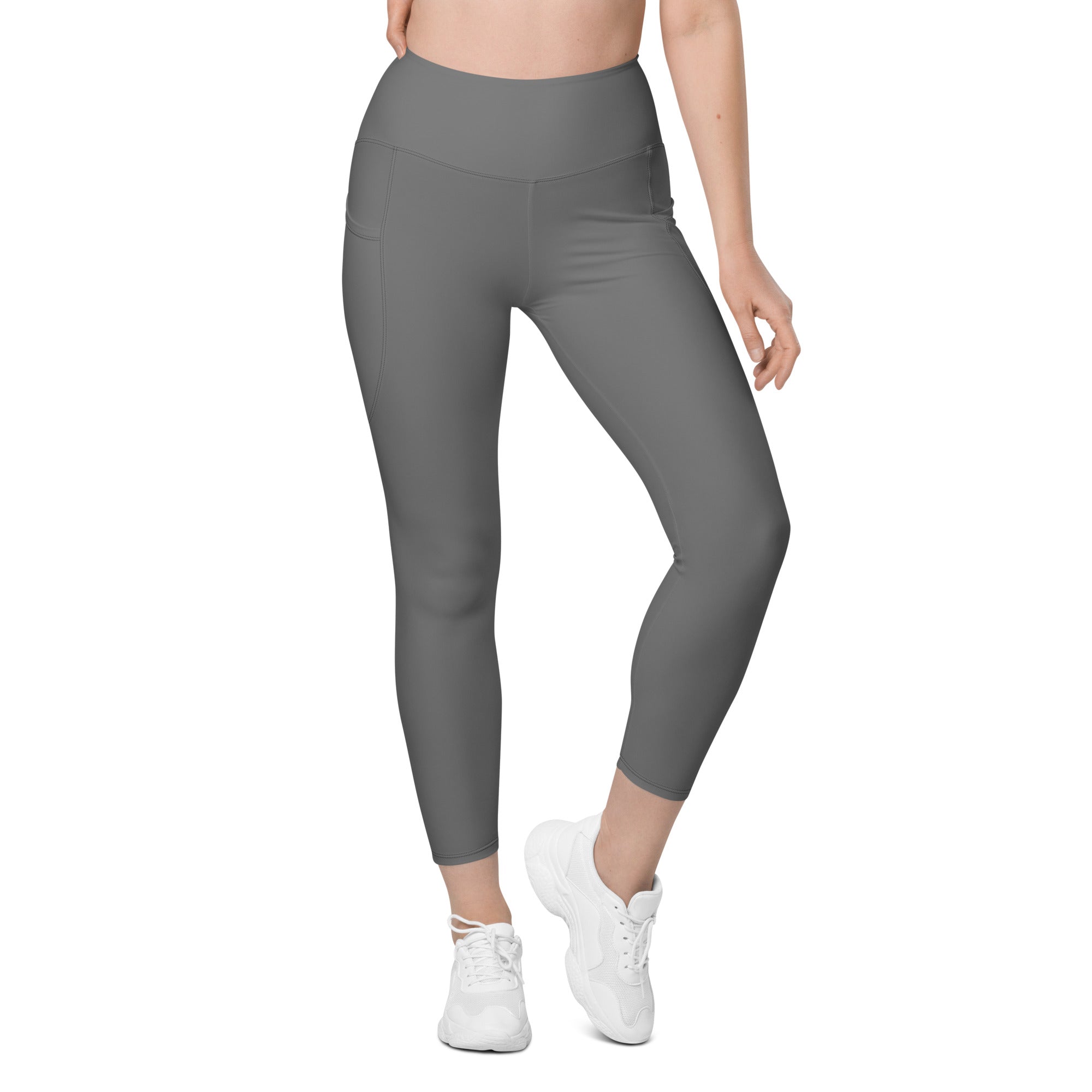 Women’s gray high-waisted yoga leggings with side pockets soft compression fabric and a sleek form-fitting design