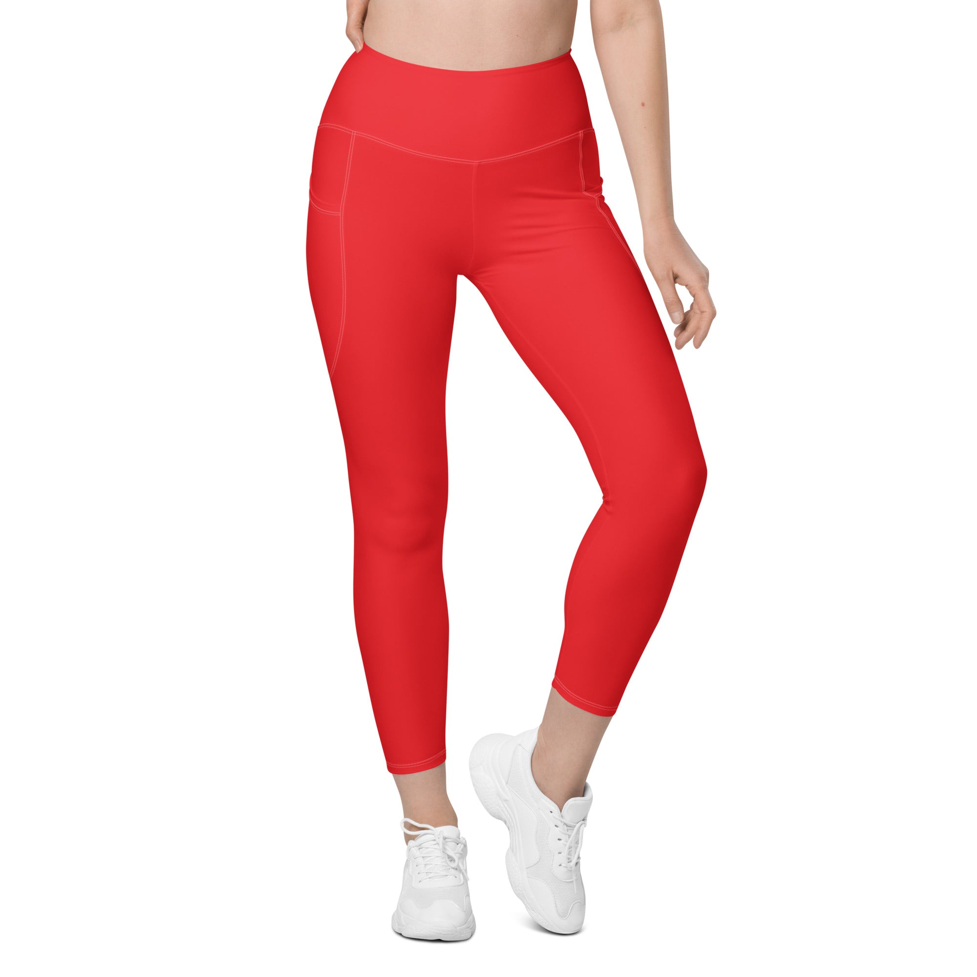 Women’s red high-waisted yoga leggings with smooth stretchy fabric and side pockets for soft compression activewear