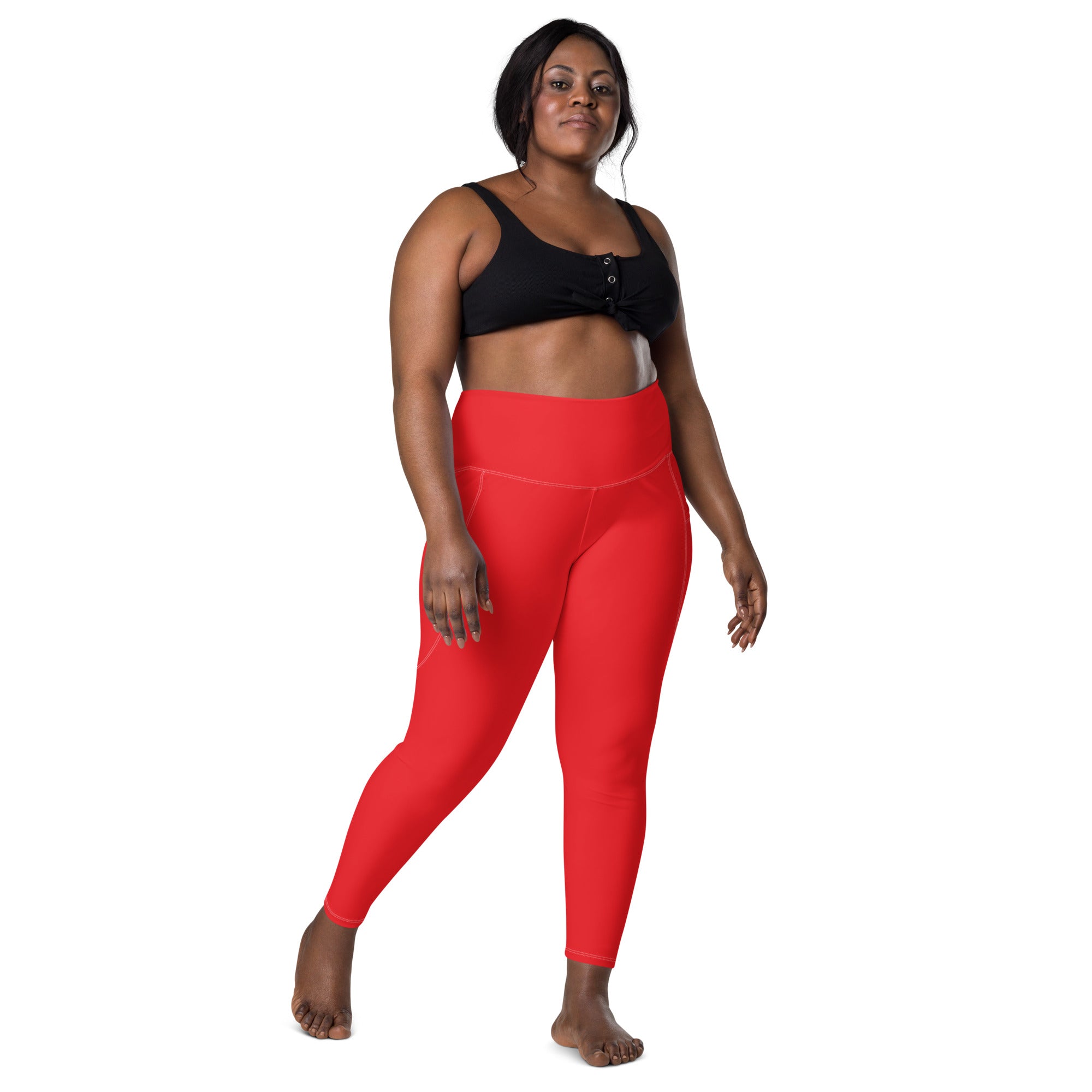 Women’s red high-waisted yoga leggings with pockets made of stretchy soft compression fabric for active wear