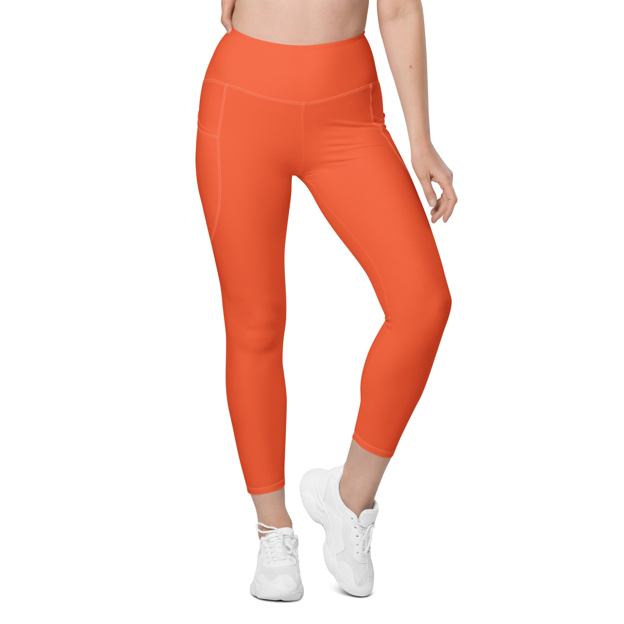Women’s orange high-waisted yoga leggings with side pockets soft compression active pants in bright orange