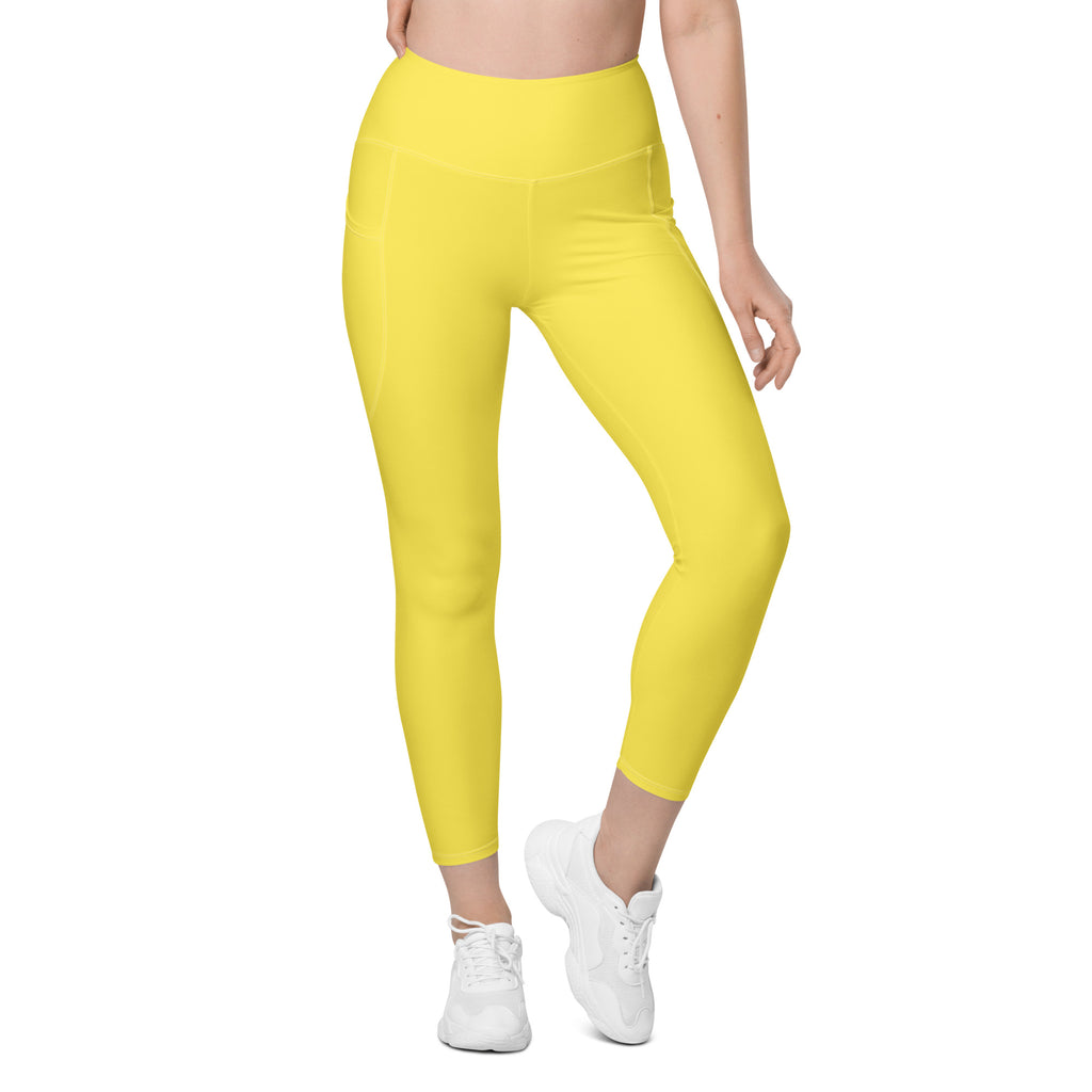 Bright yellow high-waisted yoga leggings with soft compression stretchy fabric and a convenient side pocket