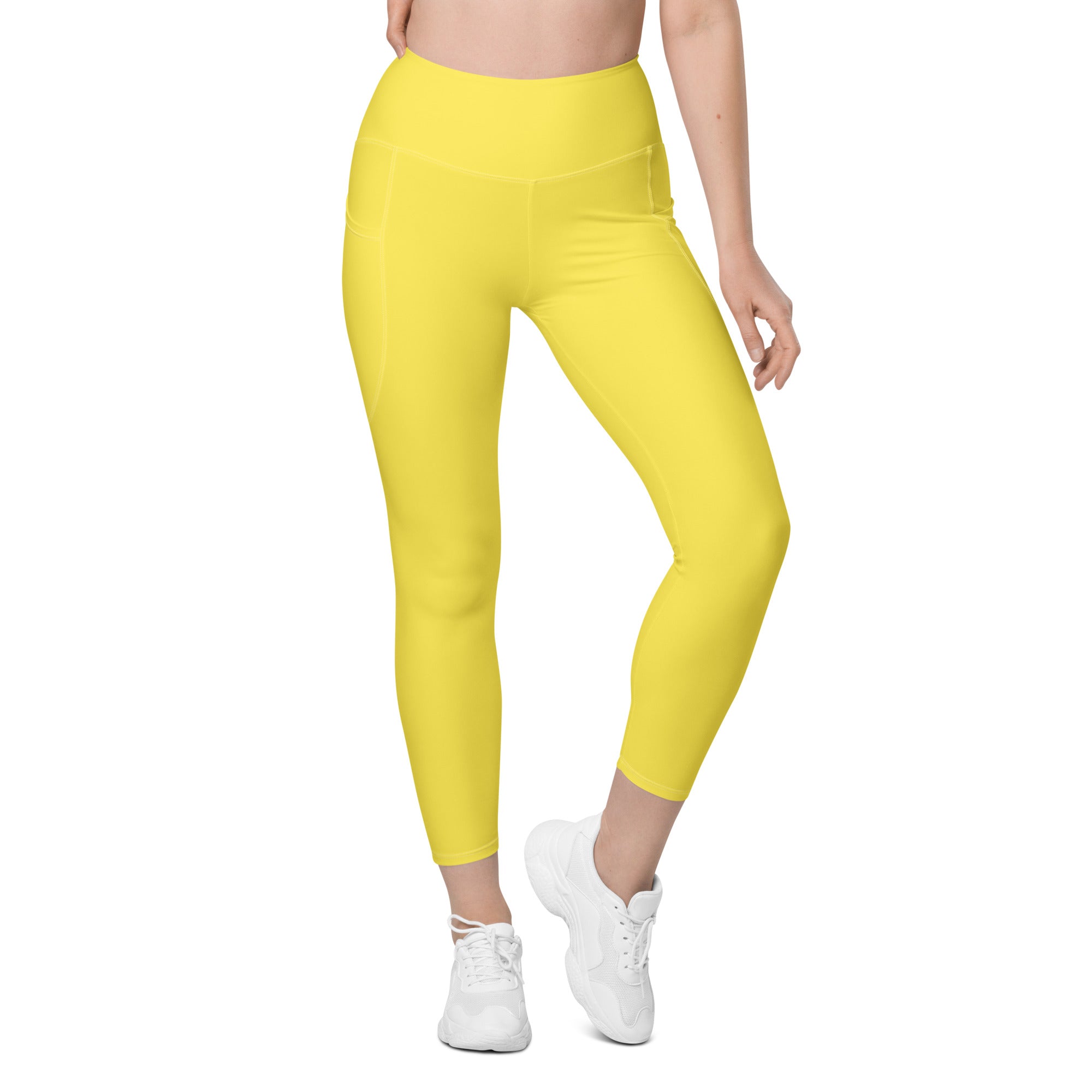 Bright yellow high-waisted yoga leggings with soft compression stretchy fabric and a convenient side pocket